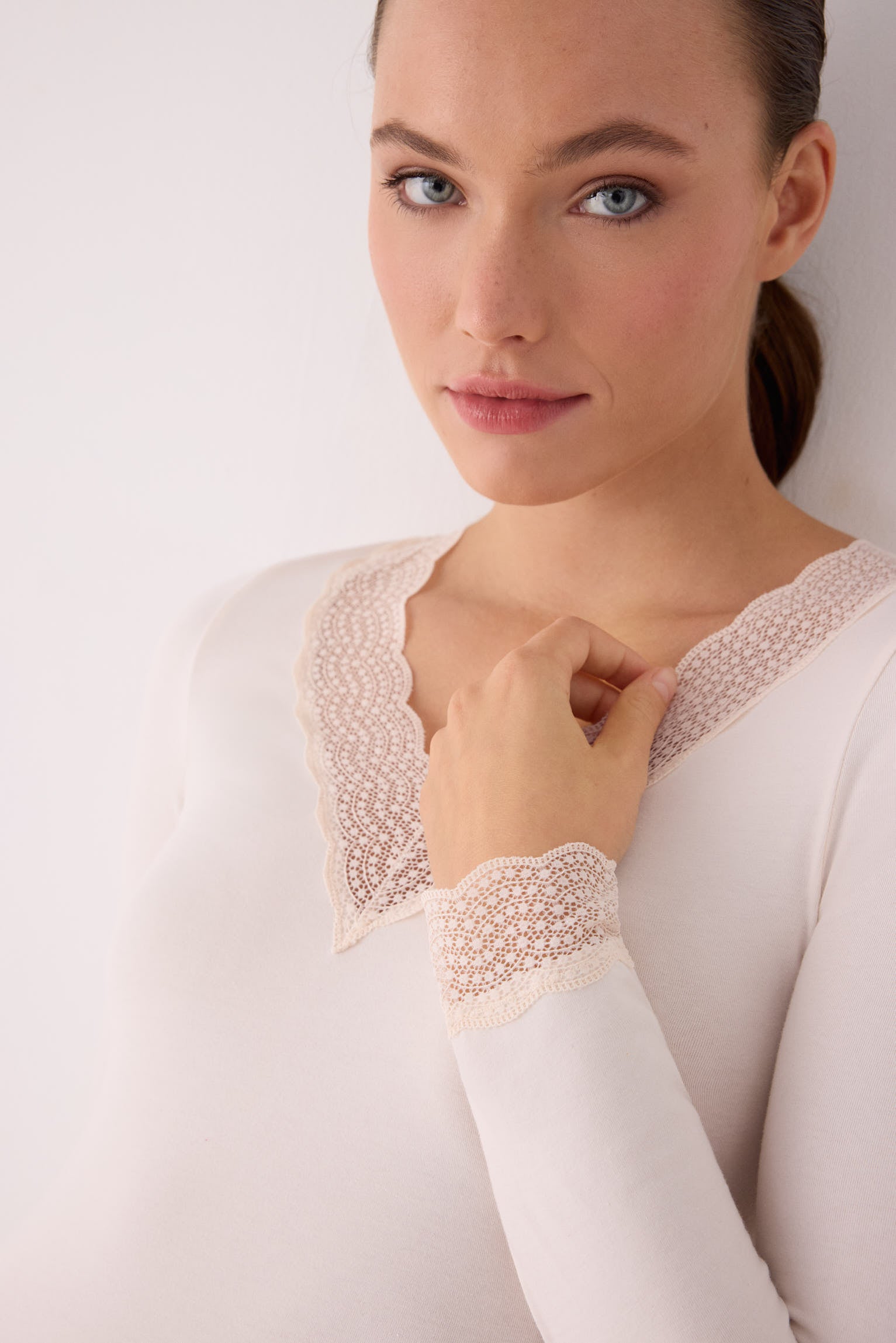 Ivory long-sleeve top with lace details