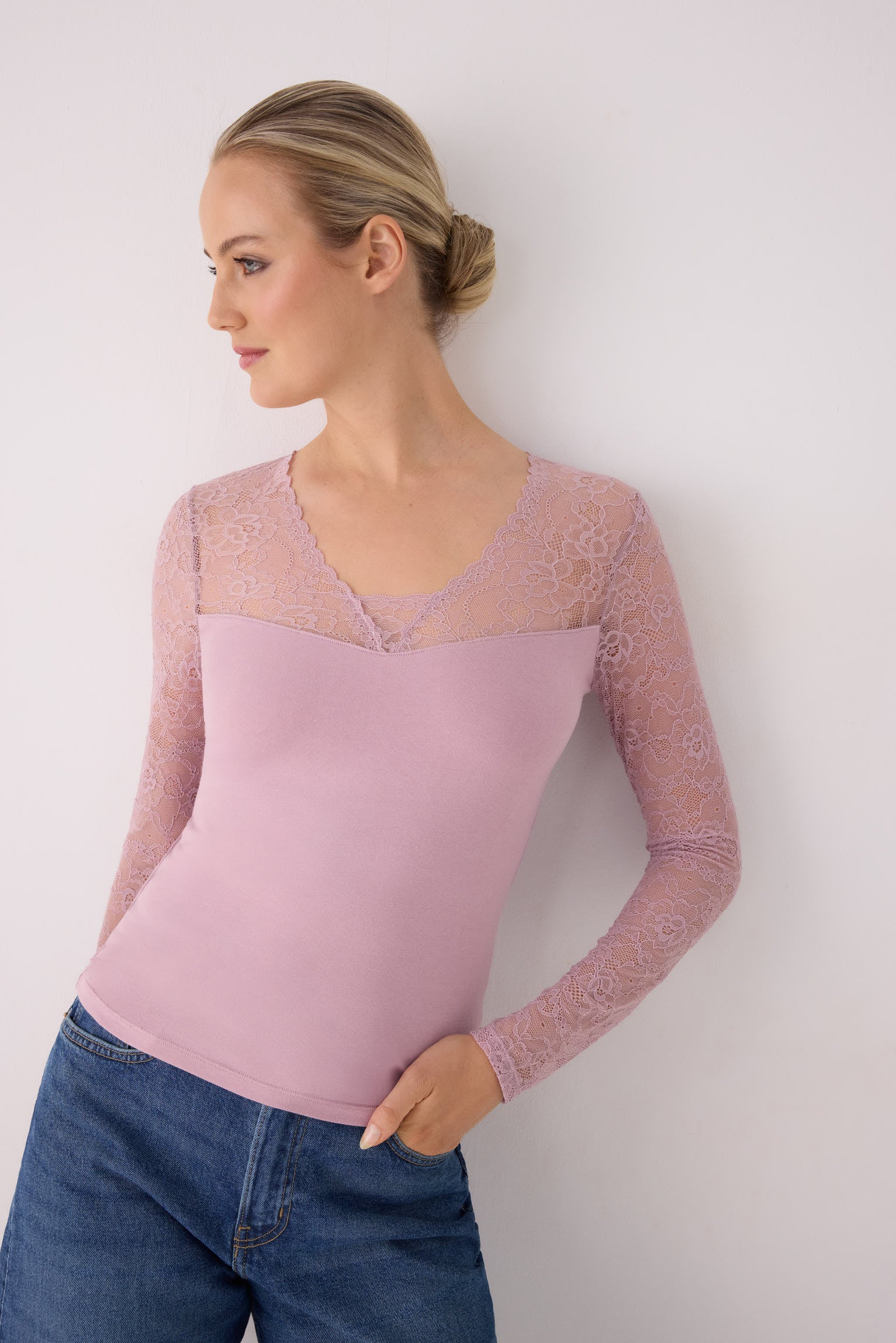 Pink long-sleeve top with lace neckline and sleeves