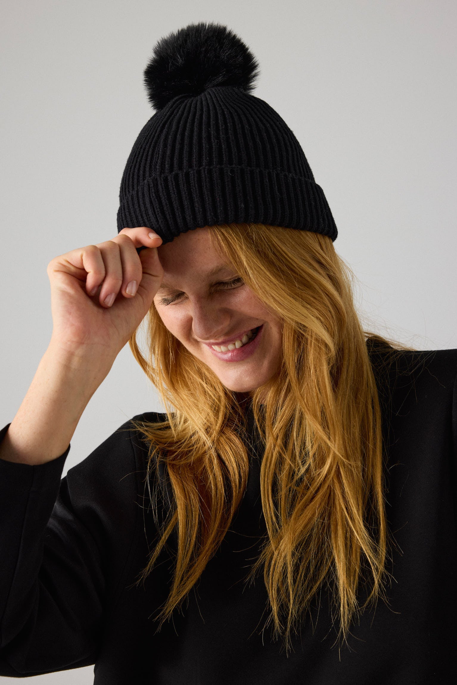 Black pompom detail hat