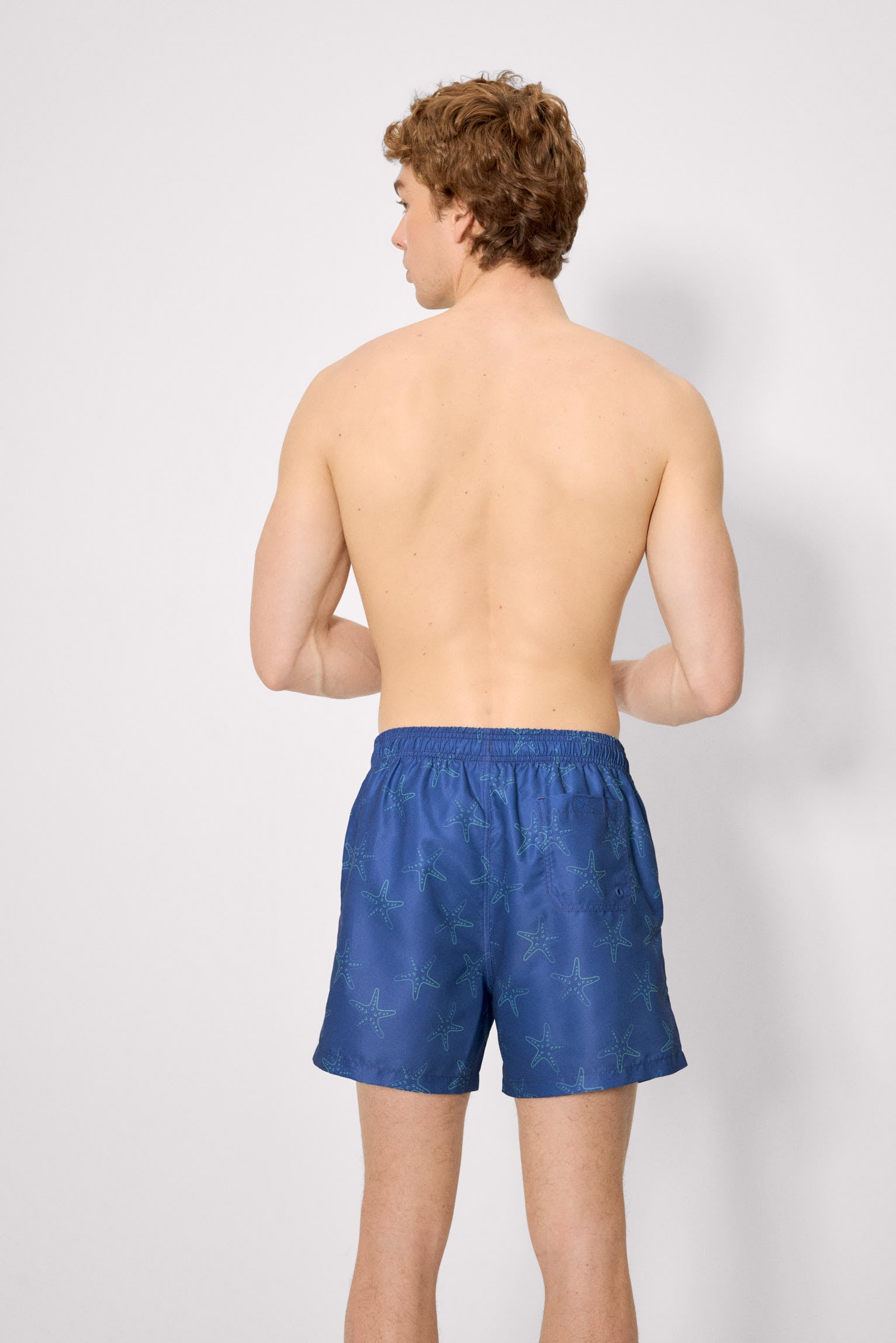 Mid-length swimsuit with starfish print in blue