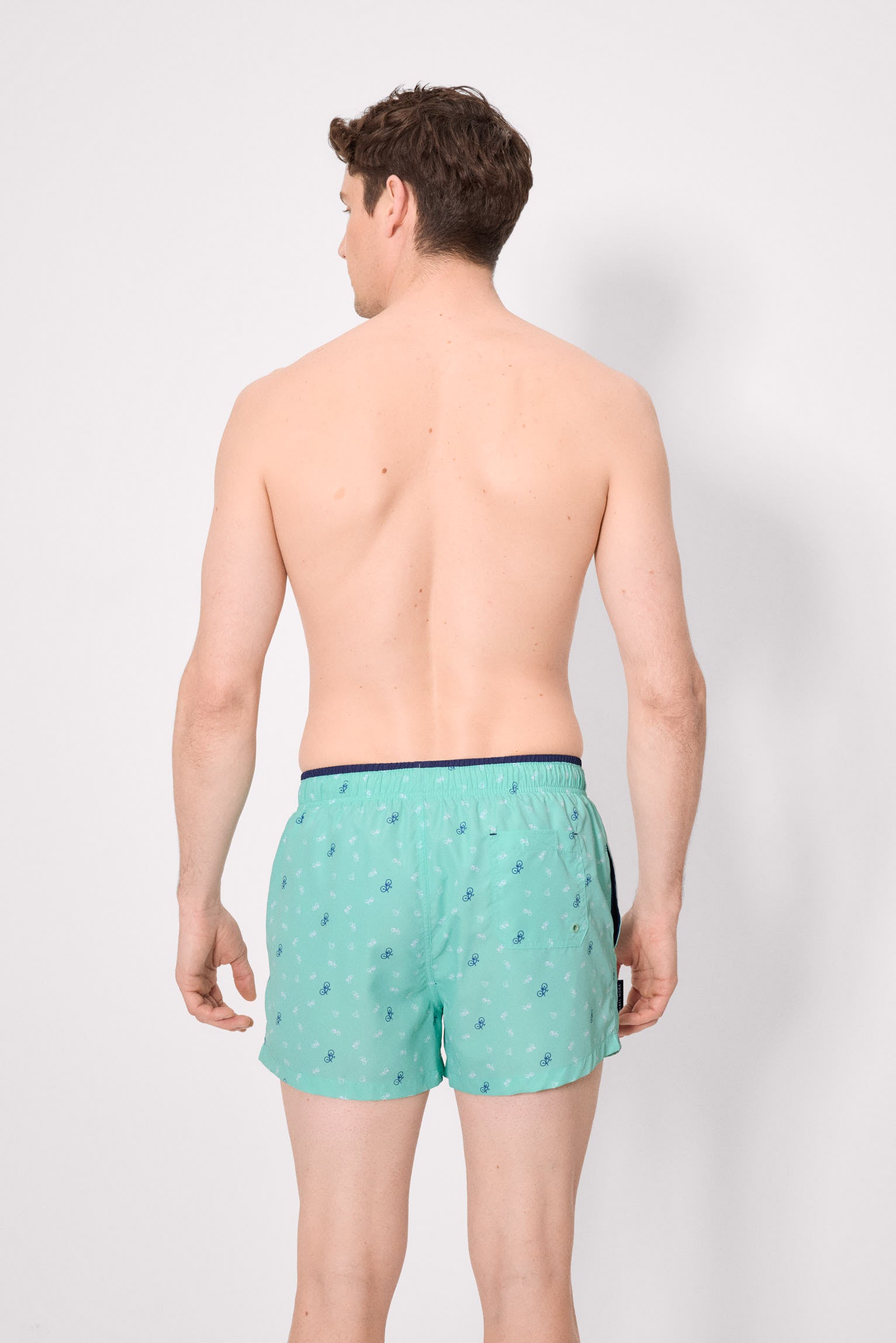 Green bicycle print swim trunks