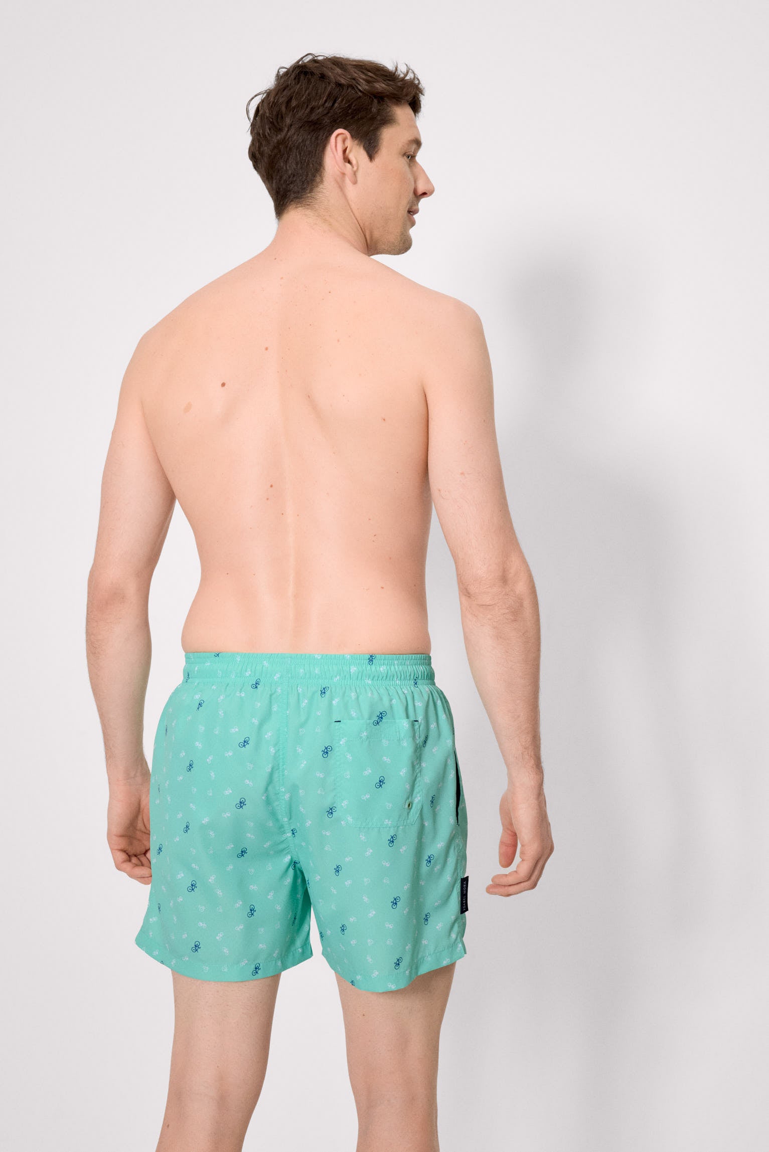 Half swimsuit with green bicycle print