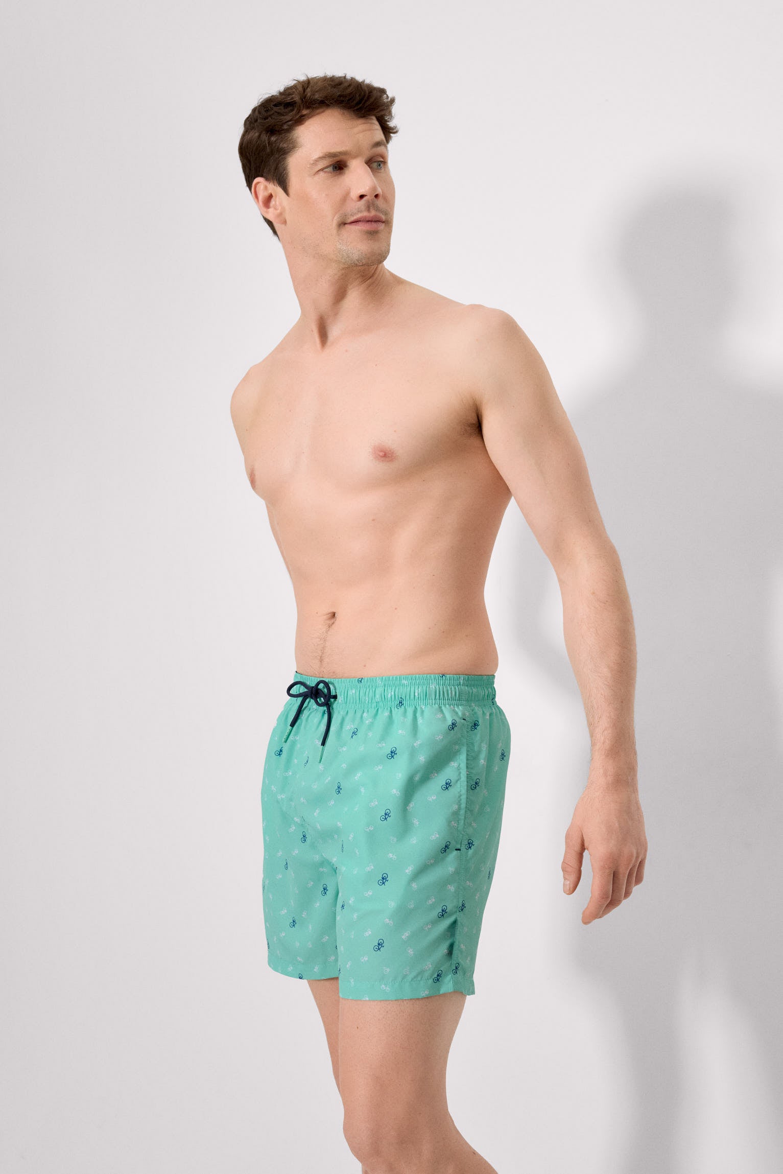 Half swimsuit with green bicycle print