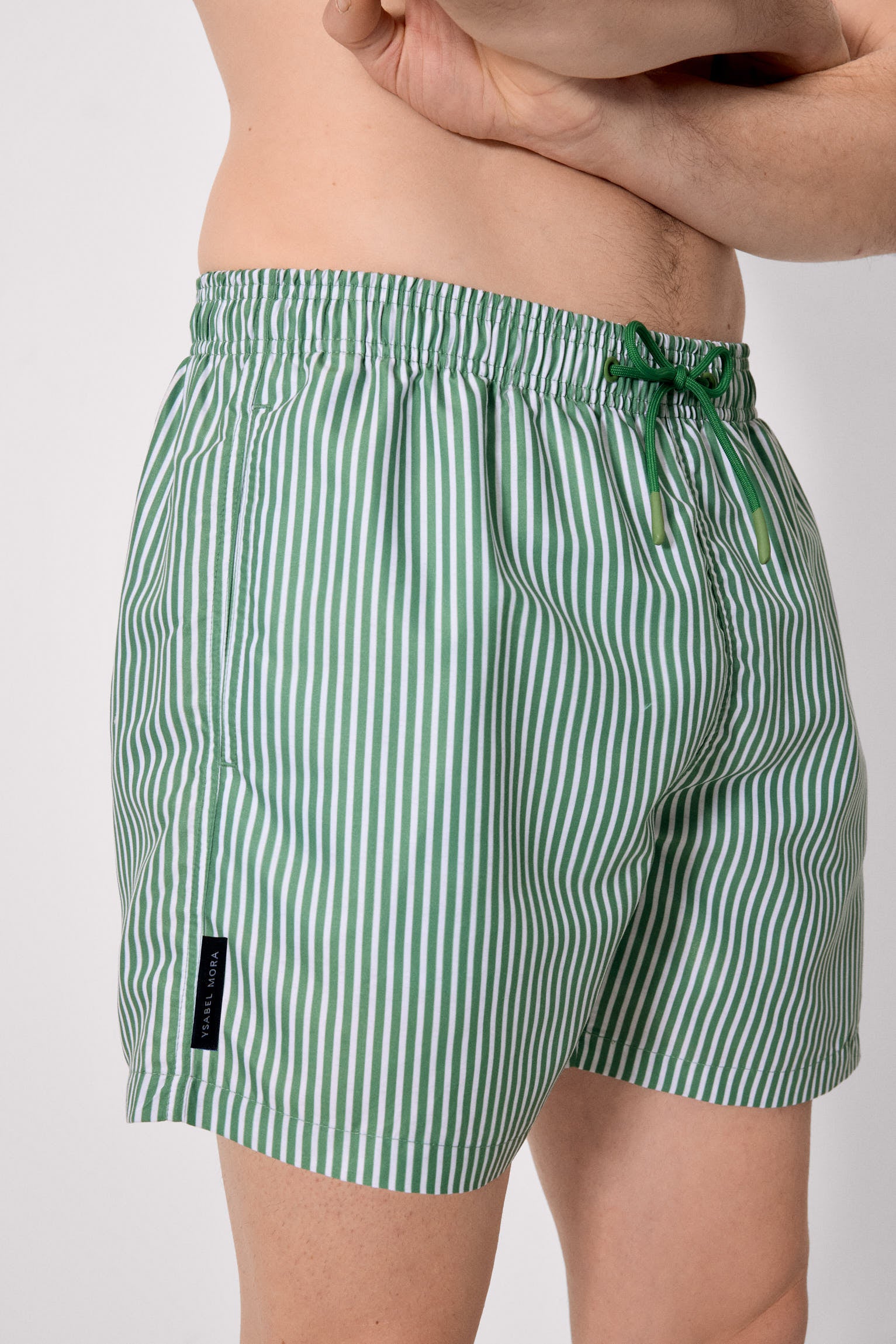 Medium-length swimsuit with green striped print