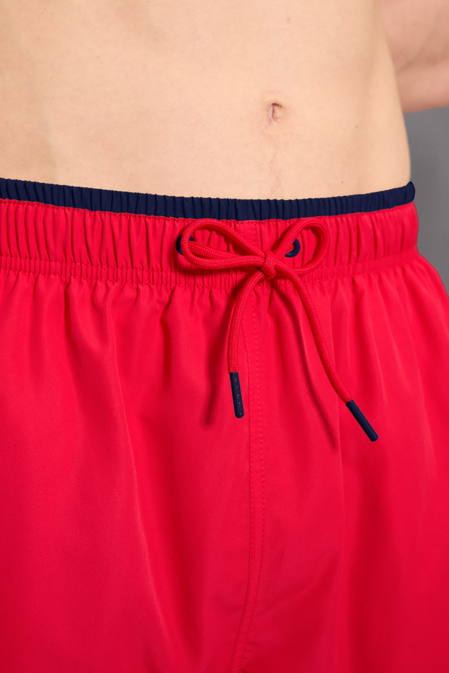 Half swimsuit with red waist detail