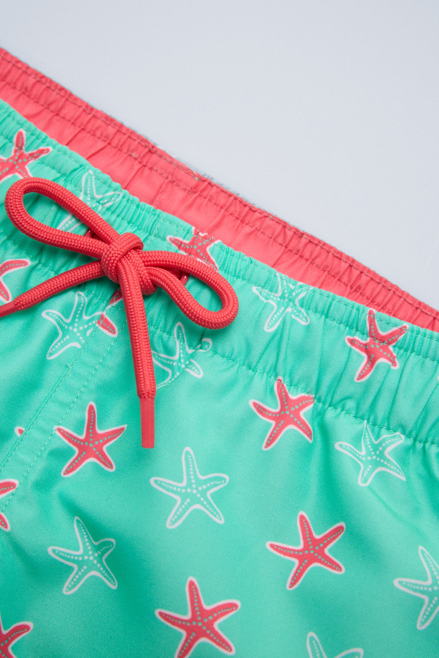 Bañdor niño corto estampado estrellas marinas turquesa - Ysabel Mora