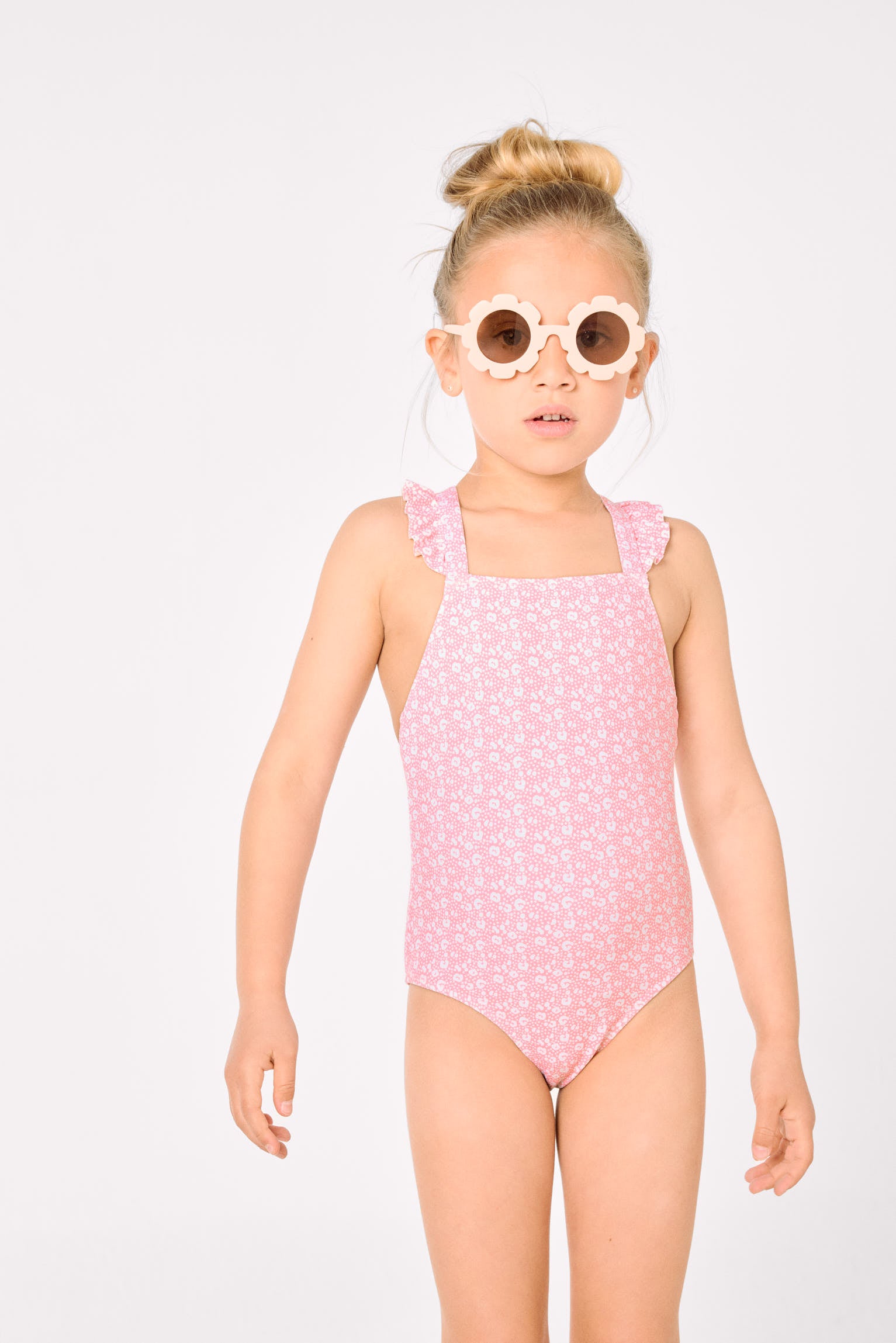 Girls' swimsuit with ruffle details and crossed straps, pink leopard print