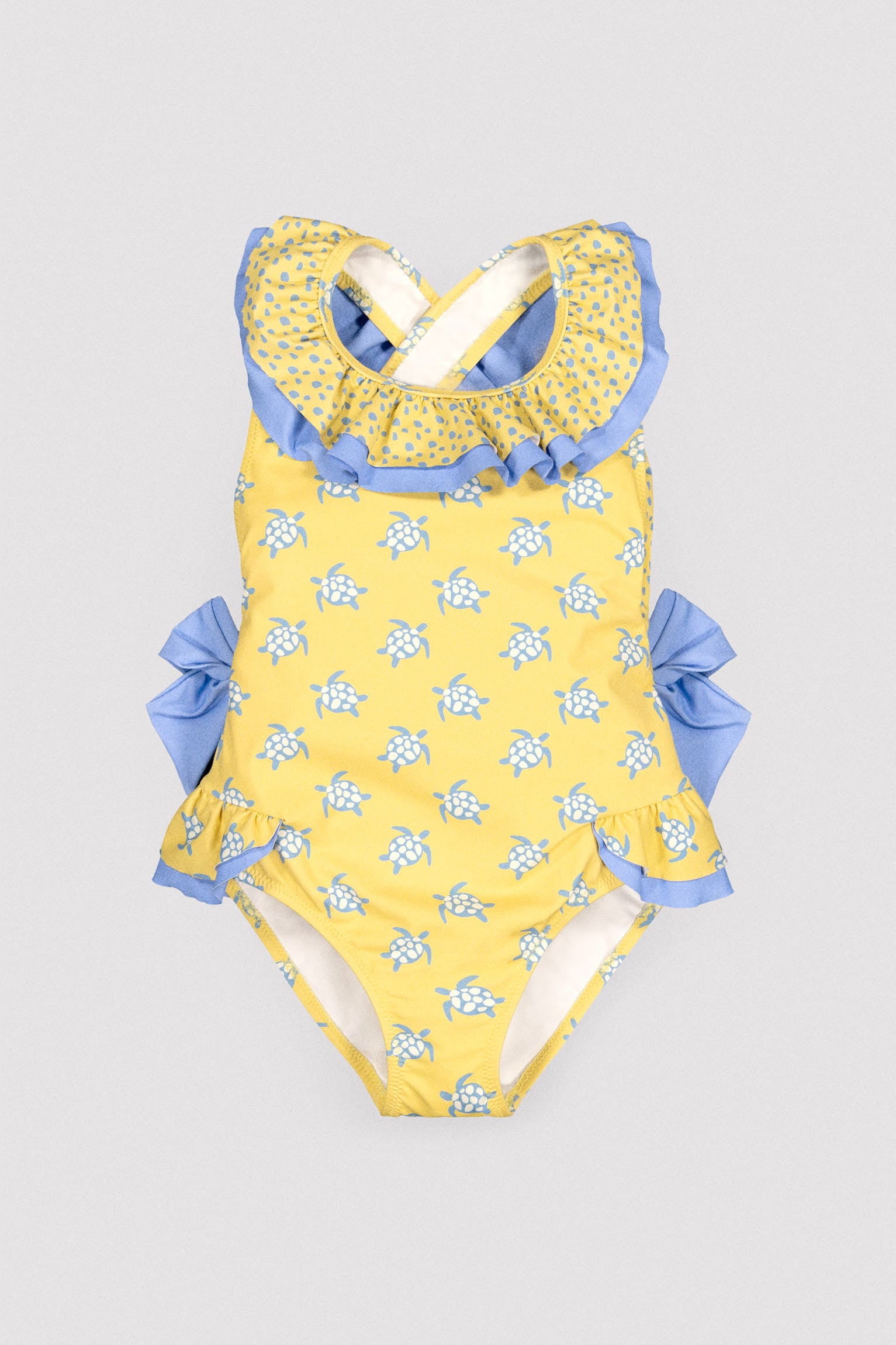 Girls' swimsuit with ruffle details and bows, turtle print