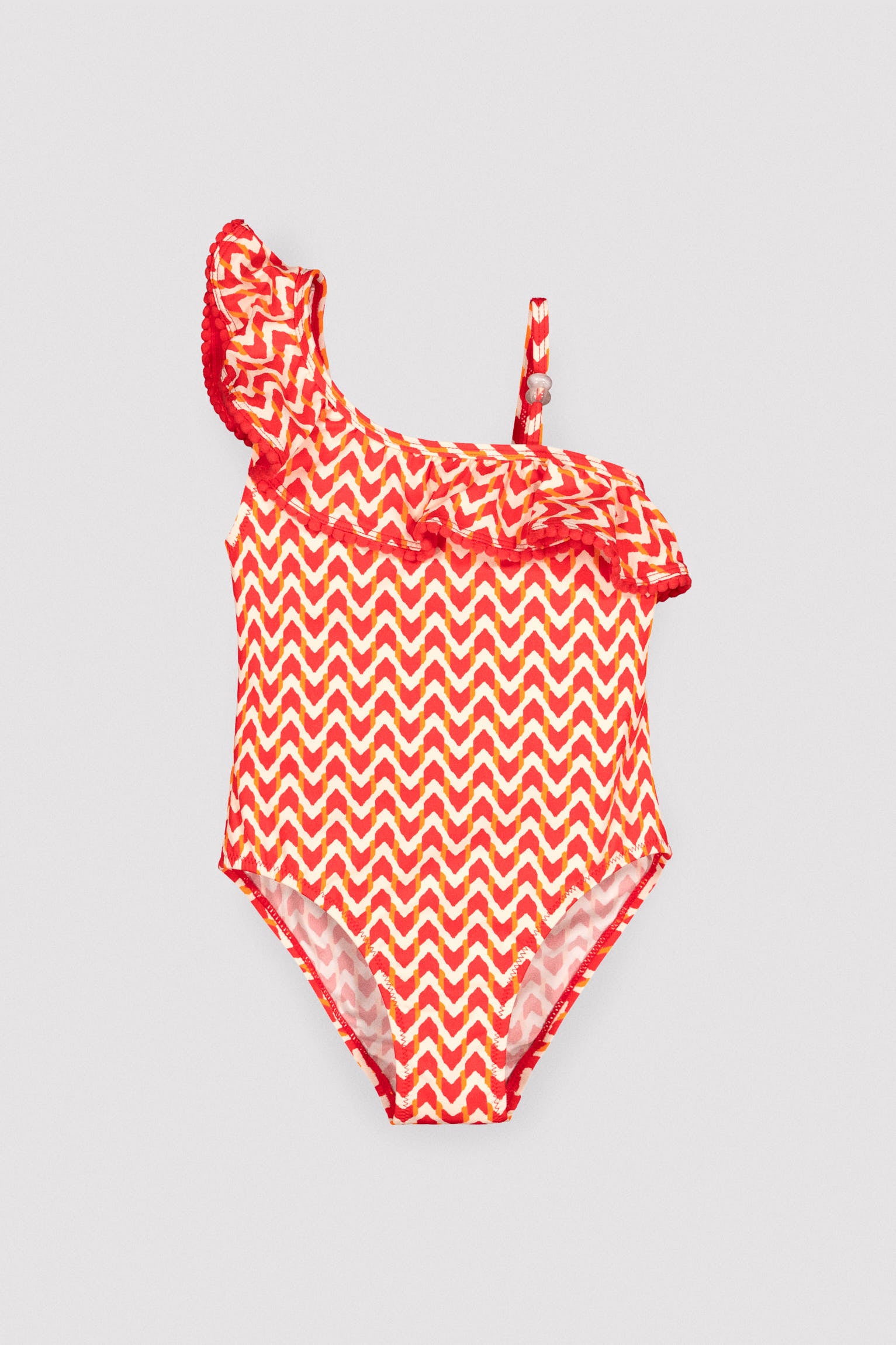 Girls' swimsuit with ruffle details and ethnic print