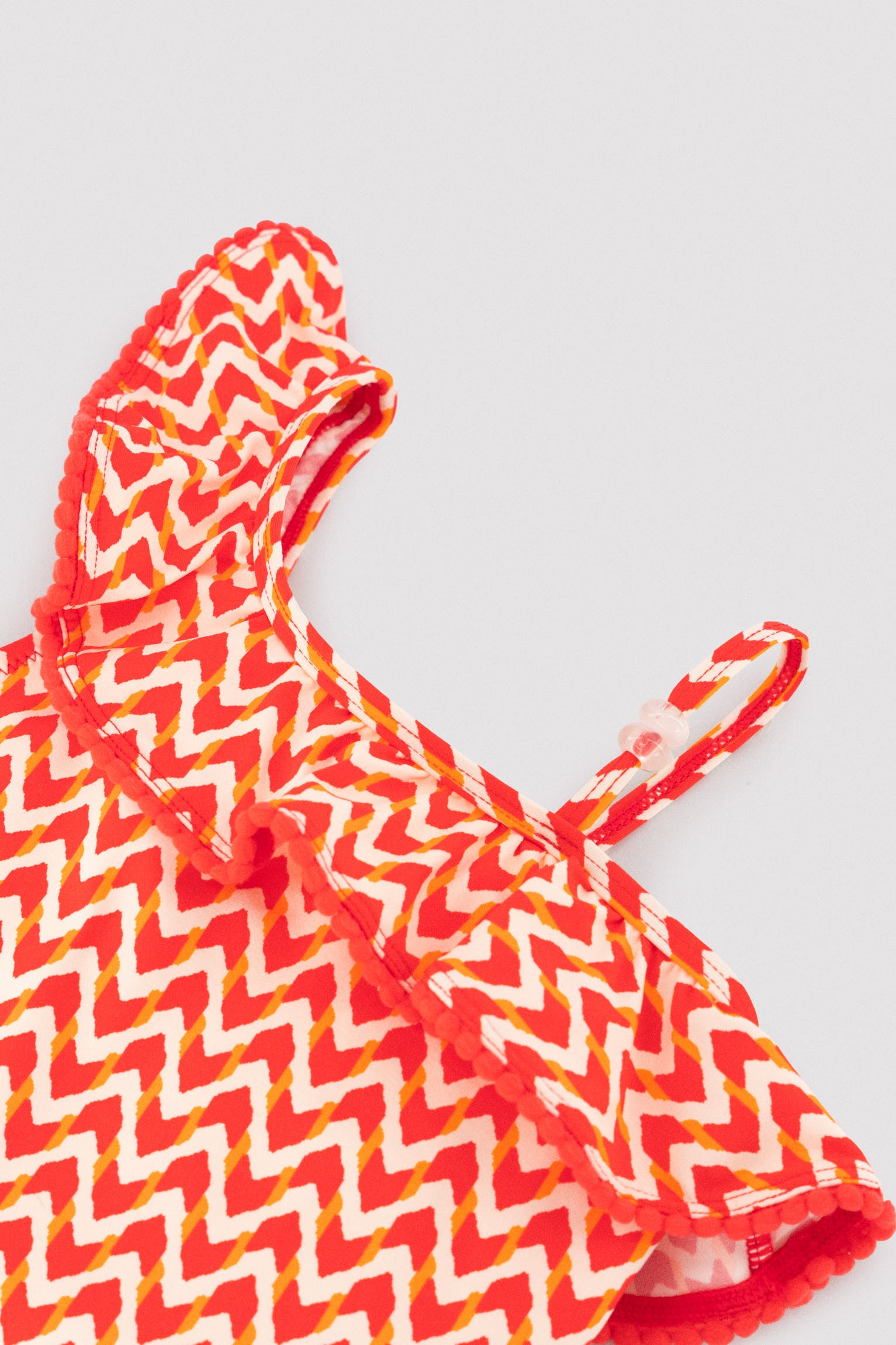 Girls' swimsuit with ruffle details and ethnic print