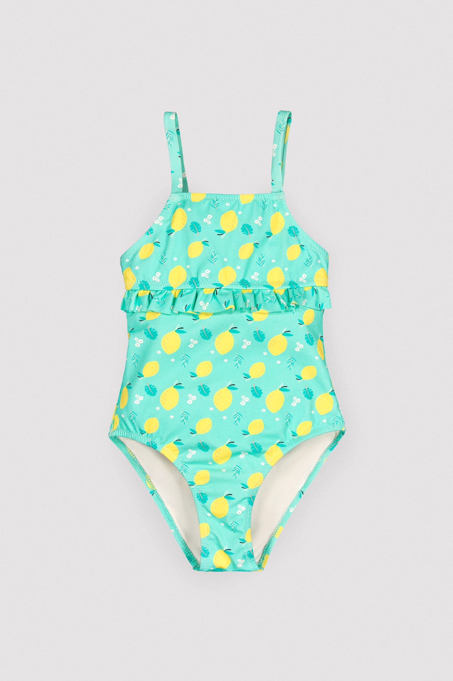 Girl's swimsuit with lemon print ruffle detail