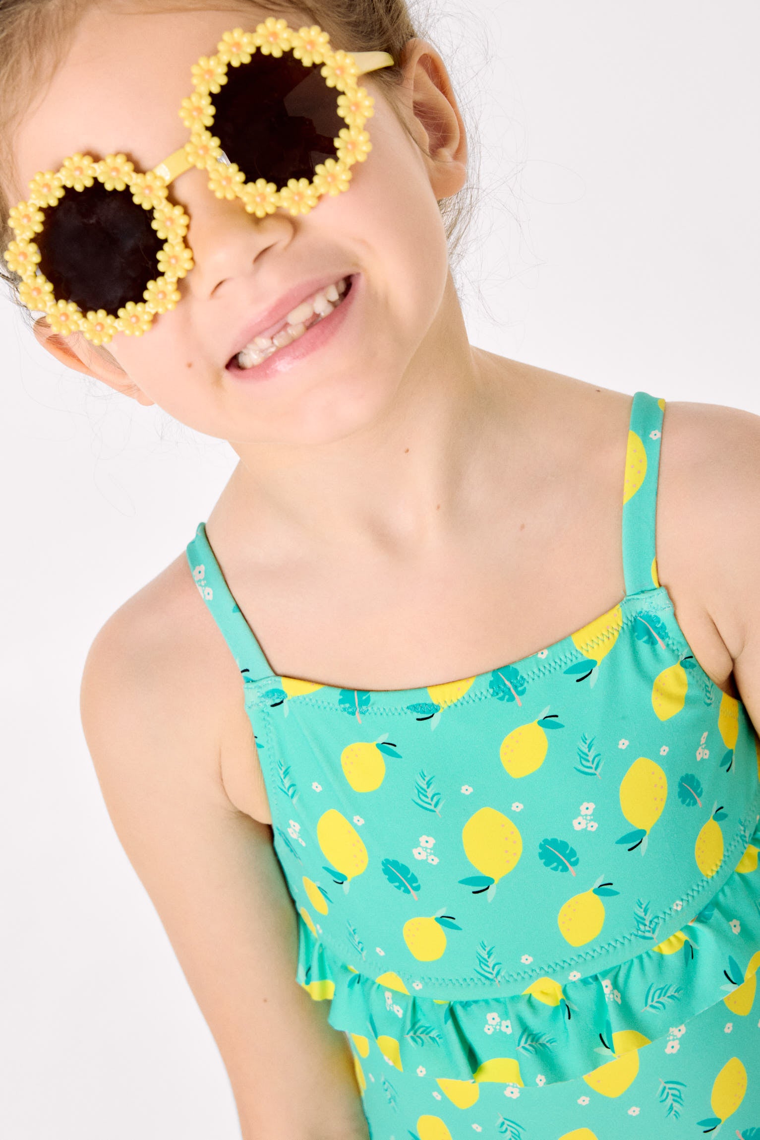 Girl's swimsuit with lemon print ruffle detail