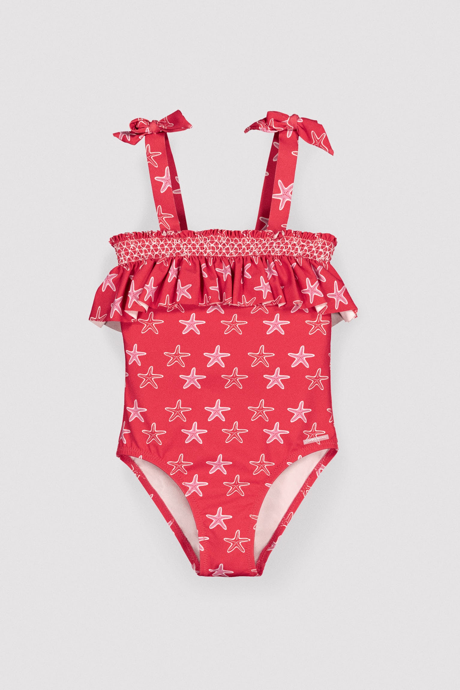Girls' swimsuit with starfish print ruffle detail