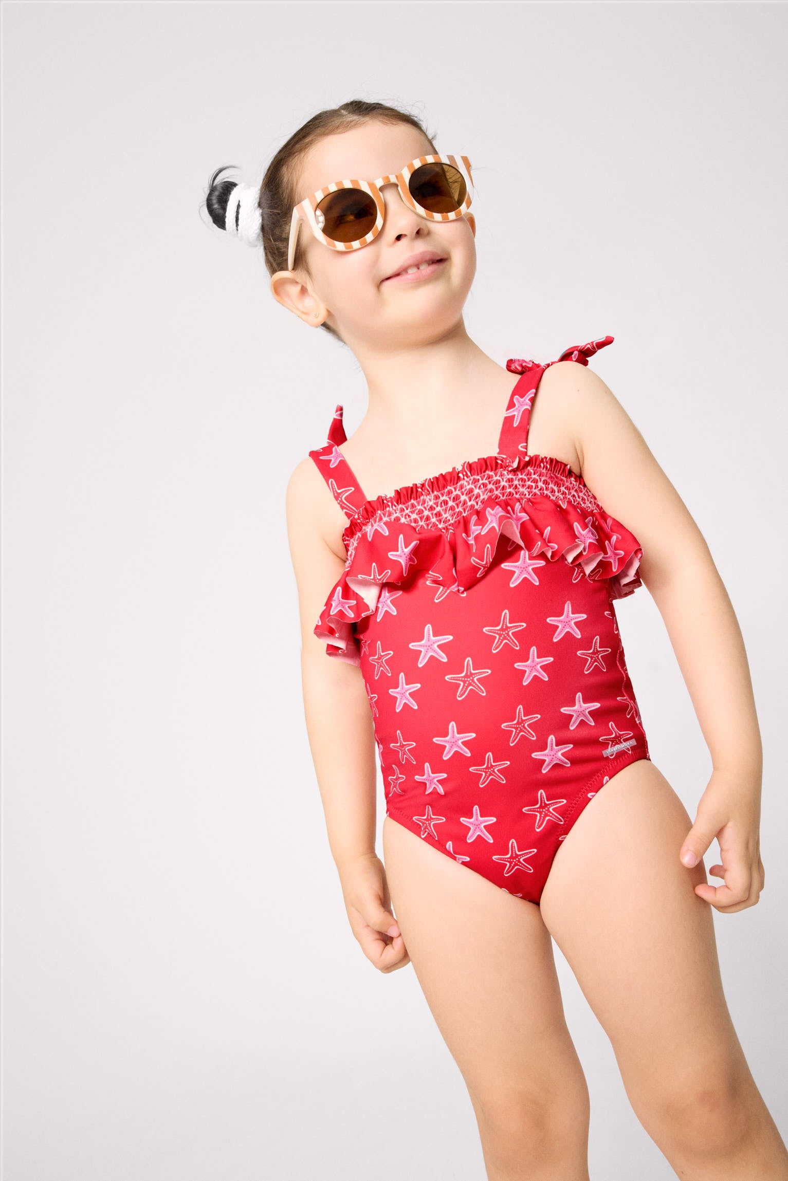 Girls' swimsuit with starfish print ruffle detail