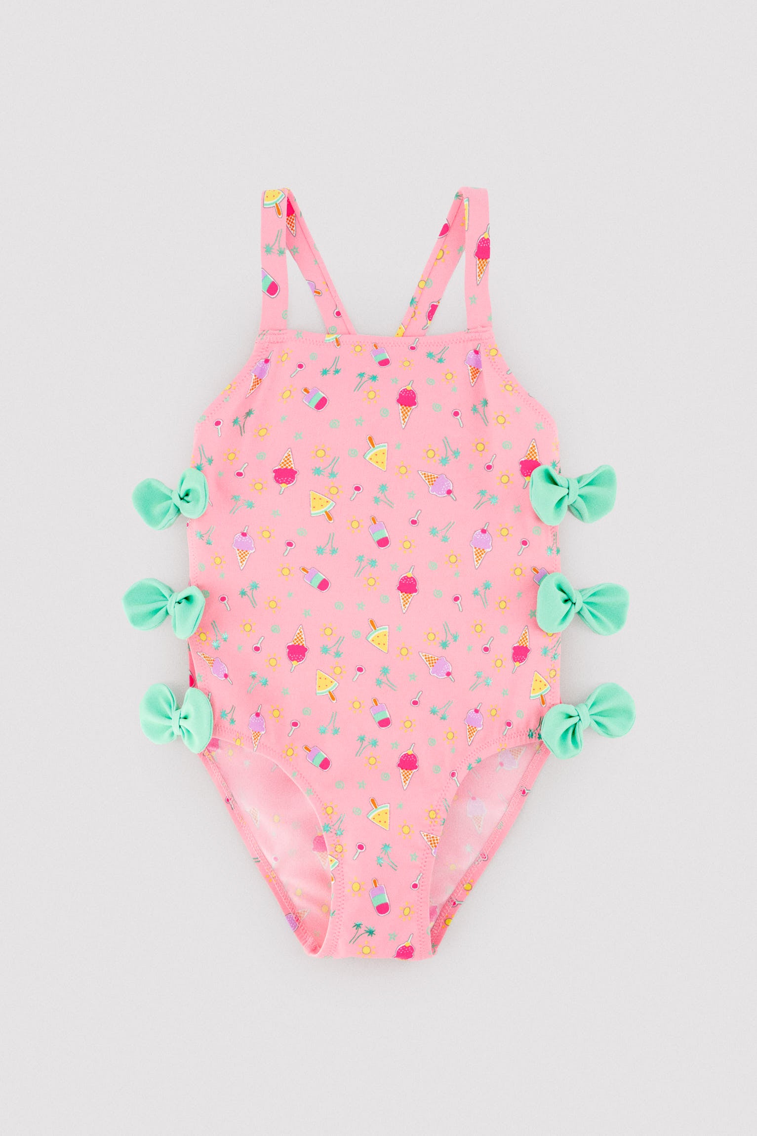 Girls' swimsuit with cut-out detail and bows, summer print