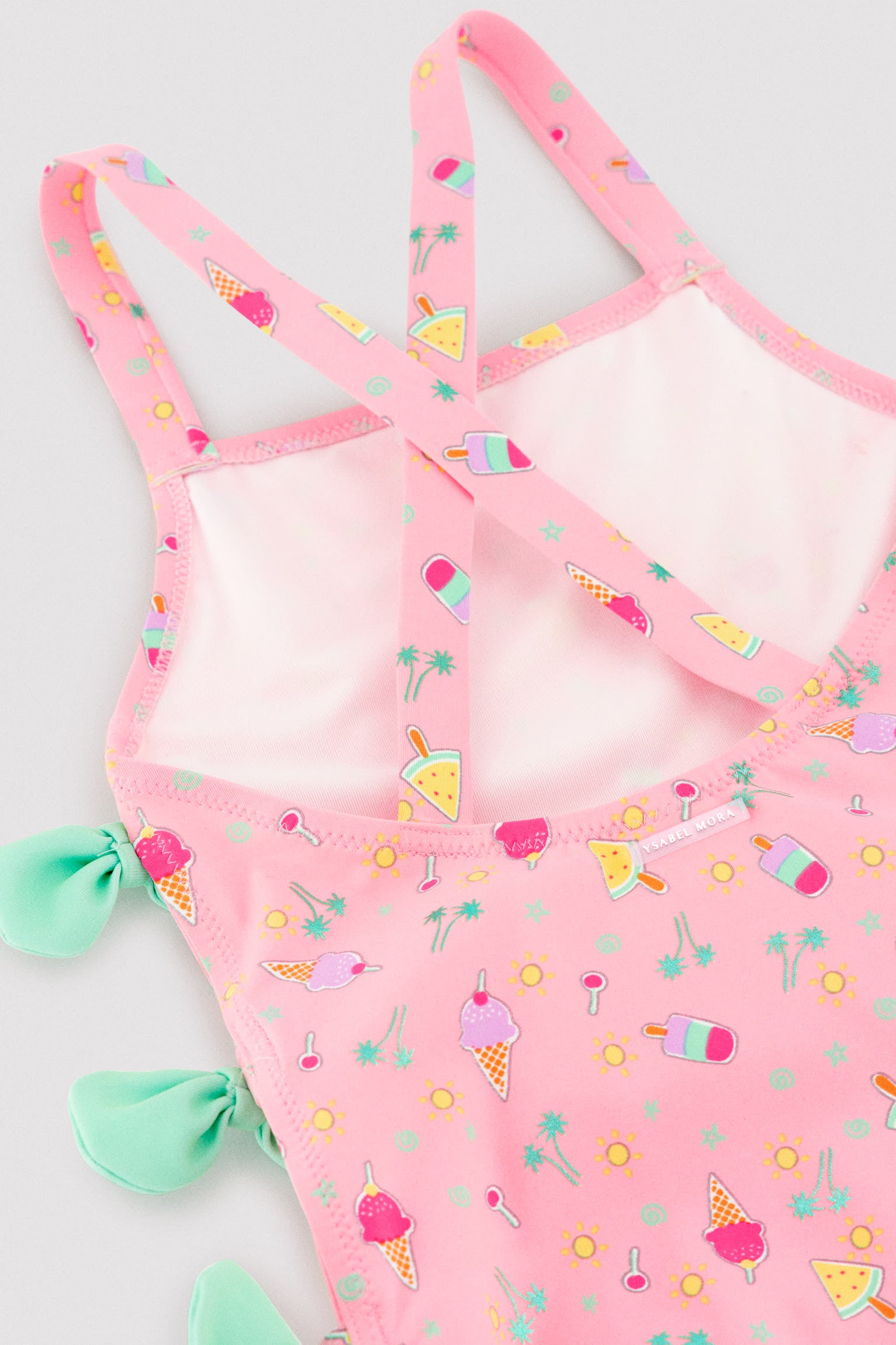 Girls' swimsuit with cut-out detail and bows, summer print