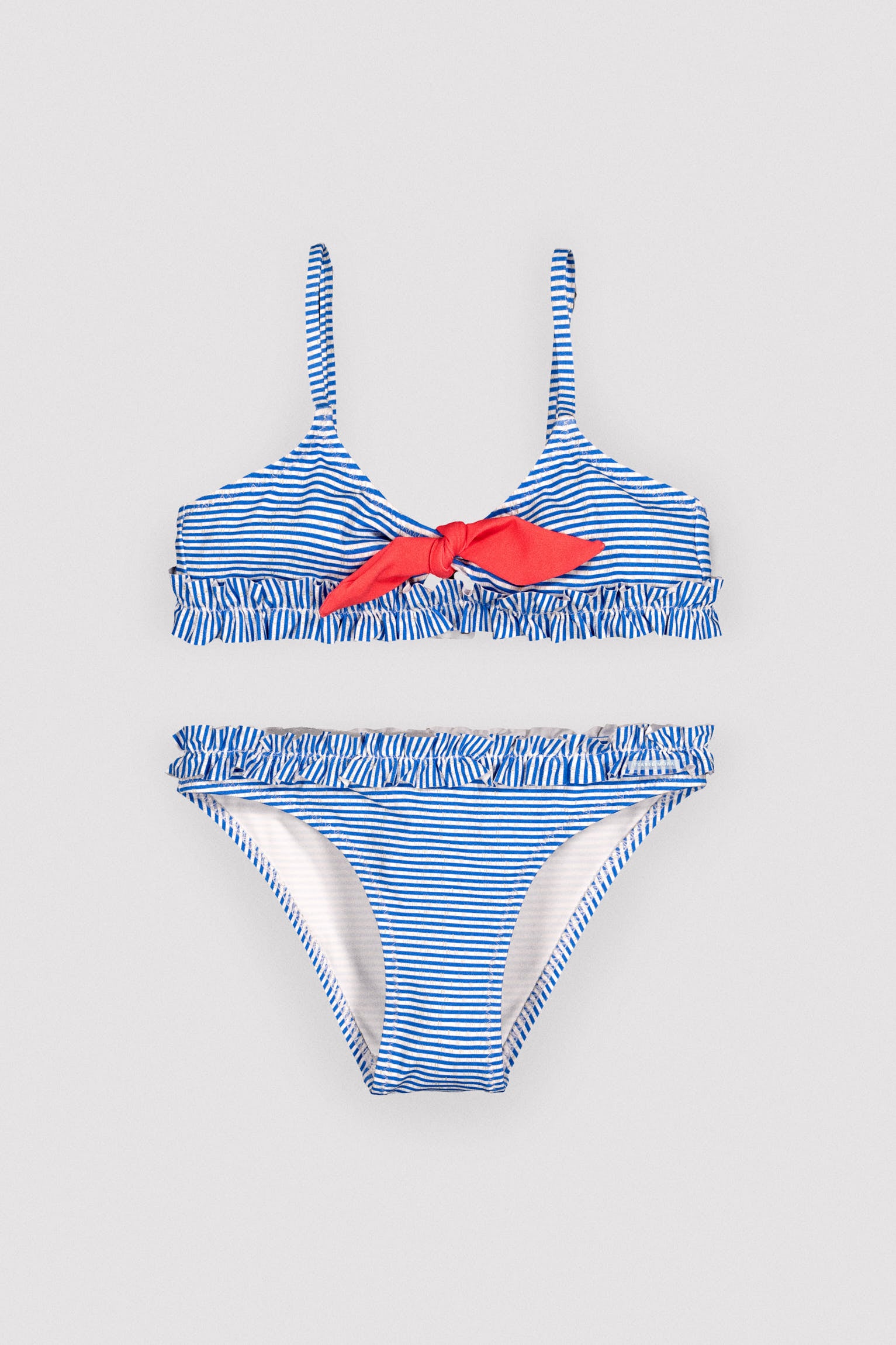 Girls' bikini with bow detail and ruching, striped print