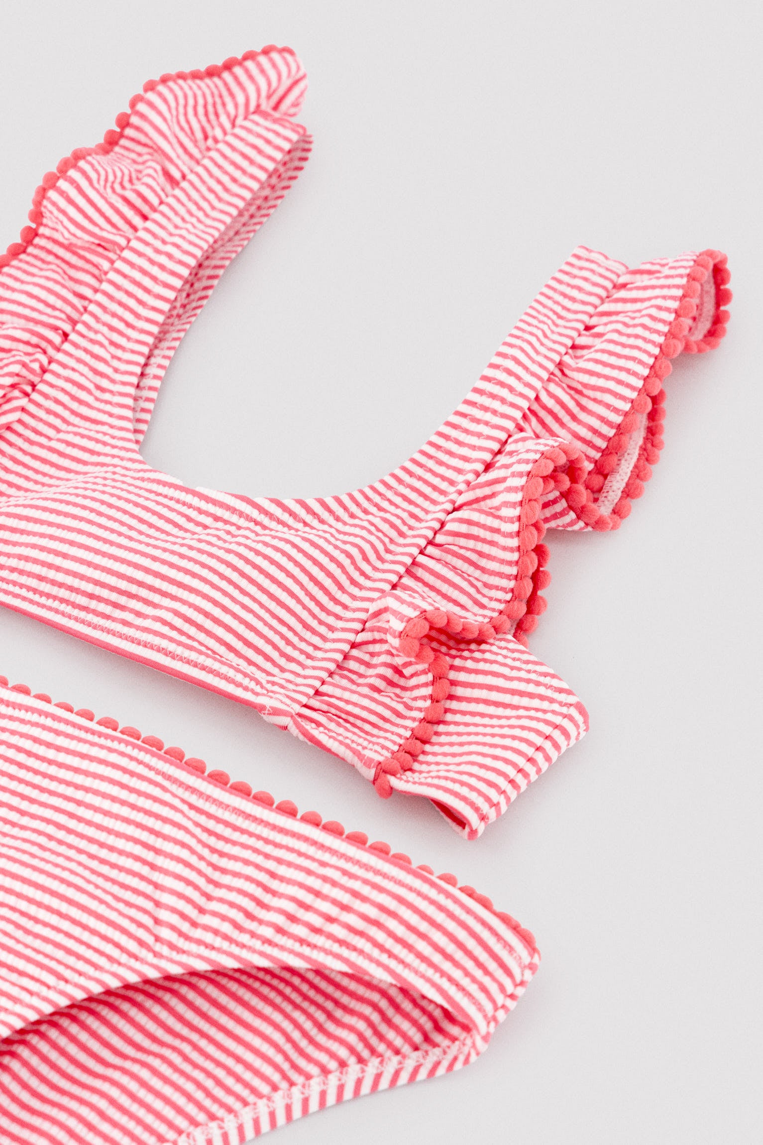 Girl's bikini with striped print ruffle detail
