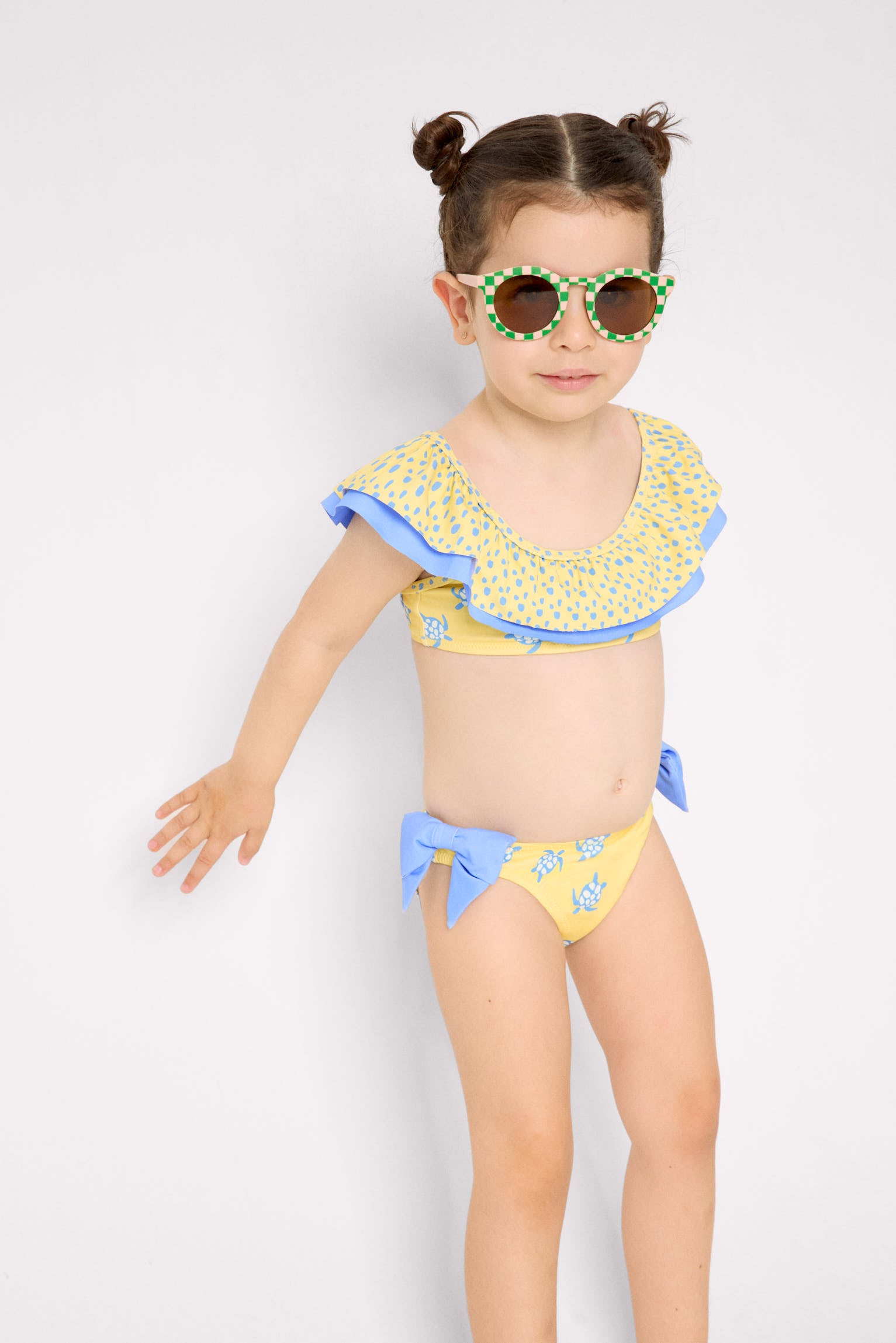 Girl's bikini with ruffle detail and bows, turtle print