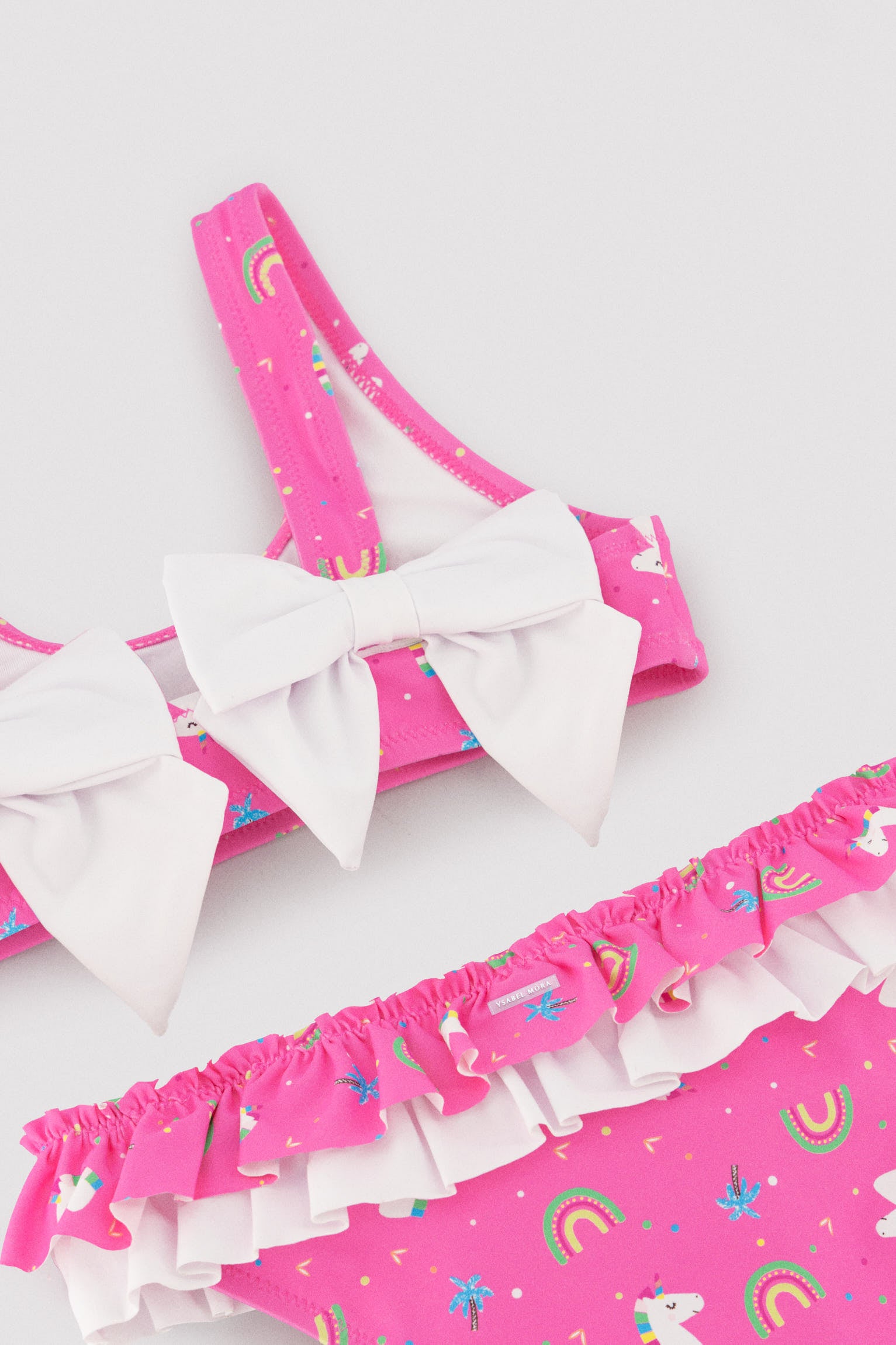 Girls' bikini with ruffle and bow details, unicorn print