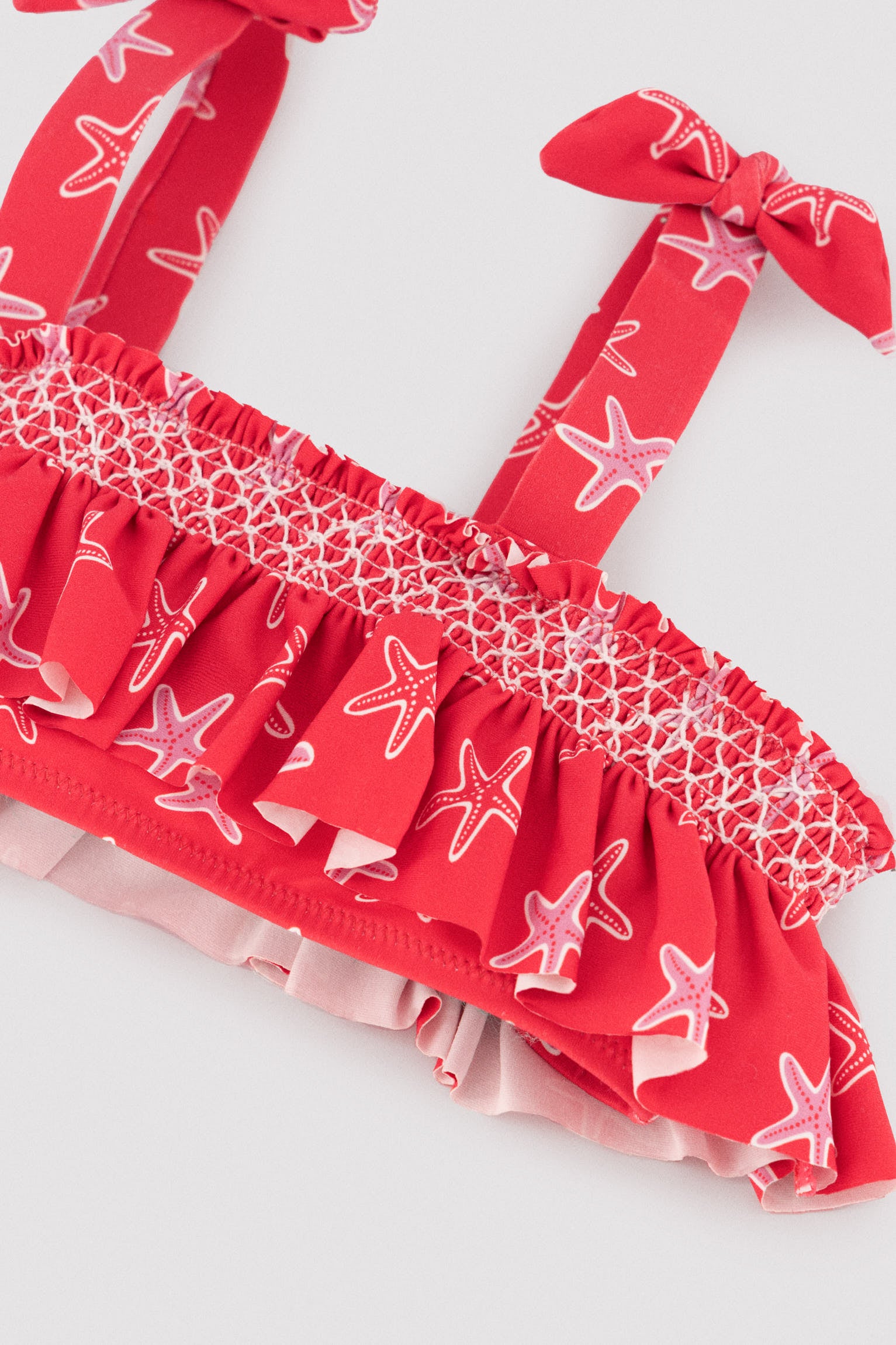 Girls' bikini with ruffle details and honeycomb pattern with starfish