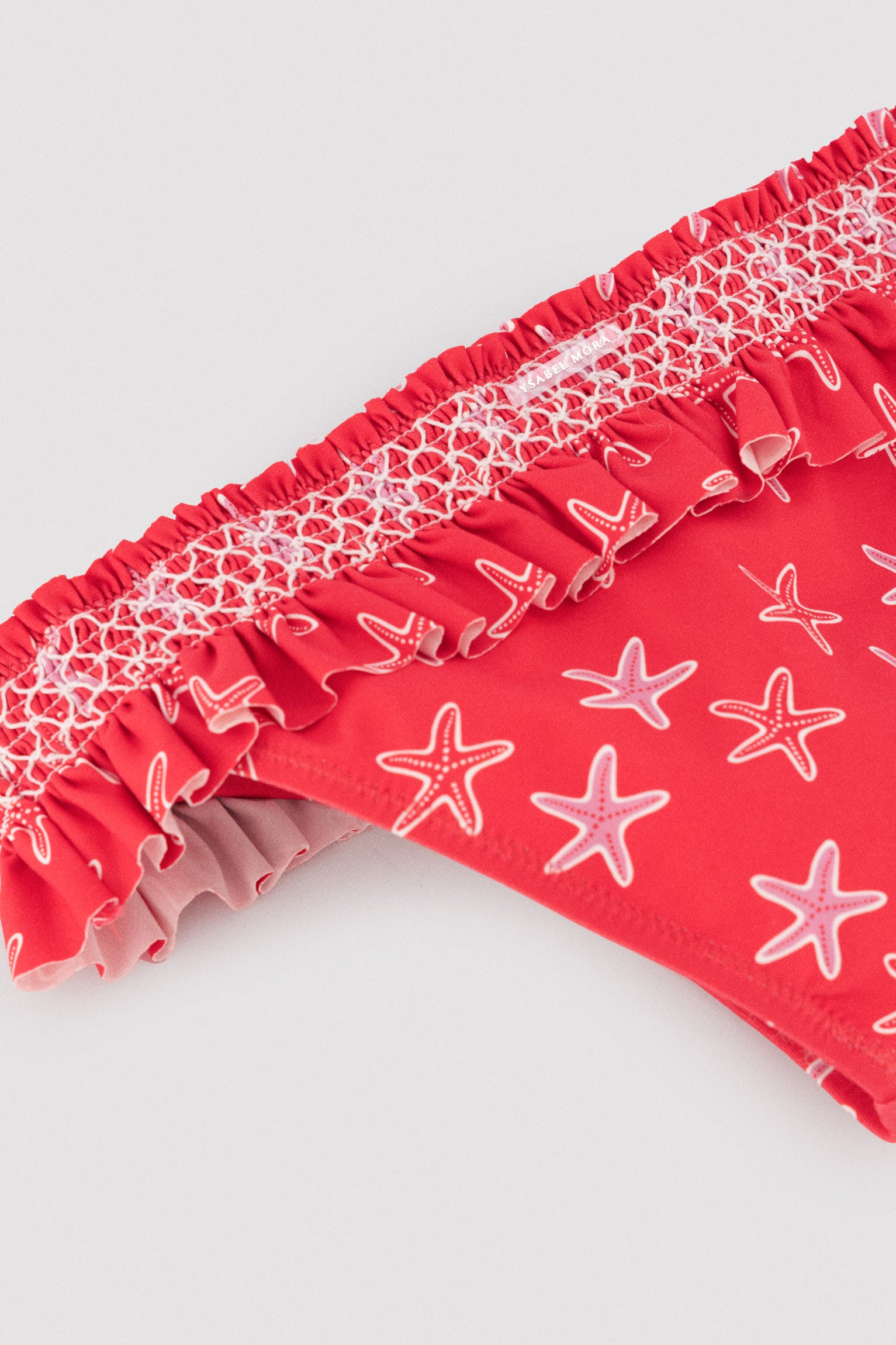 Girls' bikini with ruffle details and honeycomb pattern with starfish