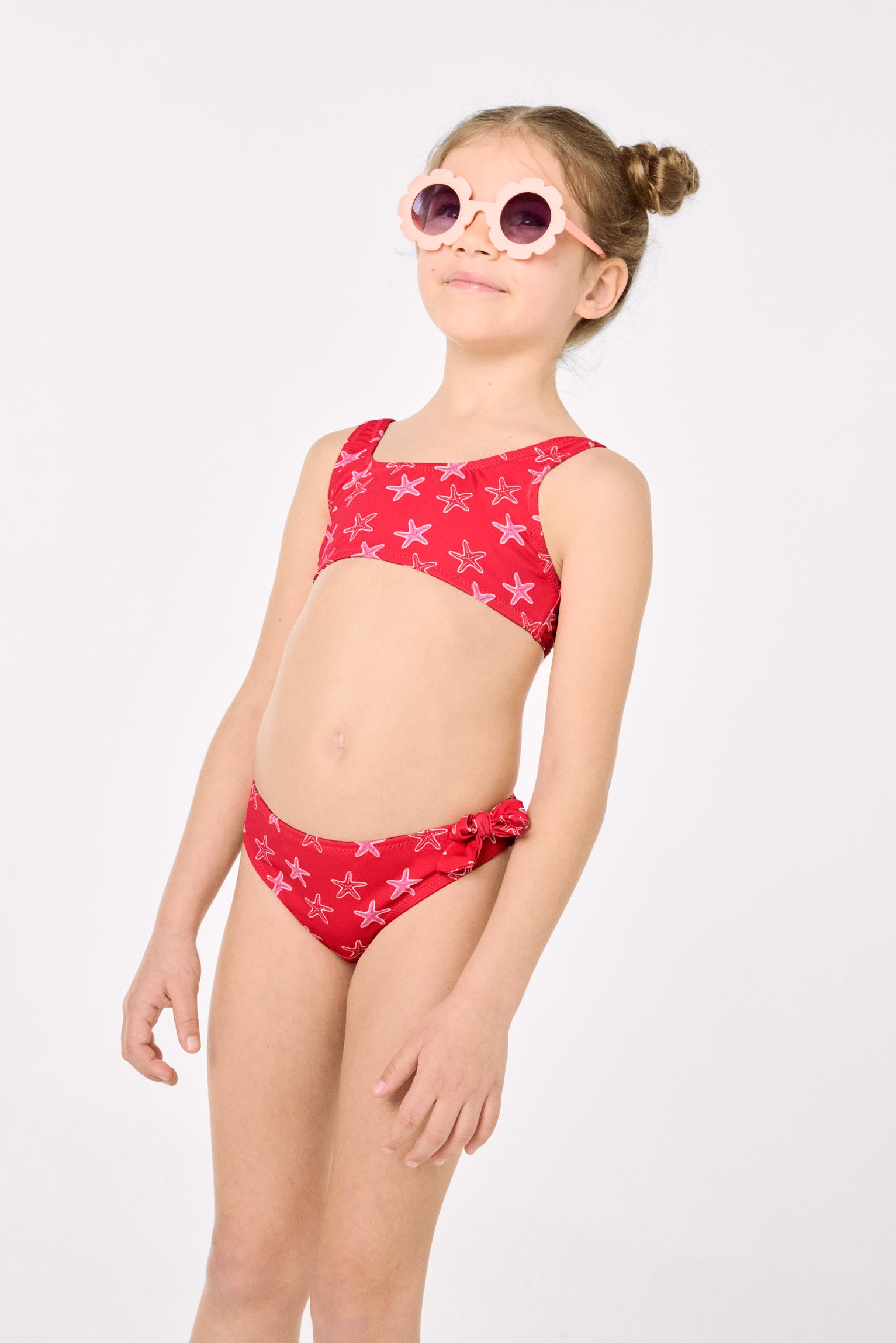 Girls' bikini with ruffle details and bows, starfish print