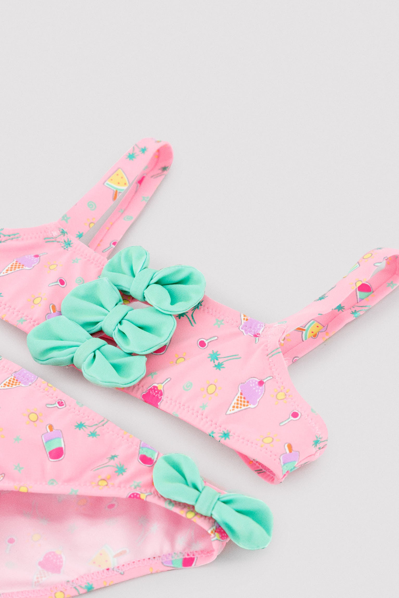 Girls' bikini with bow details and an ice cream summer print