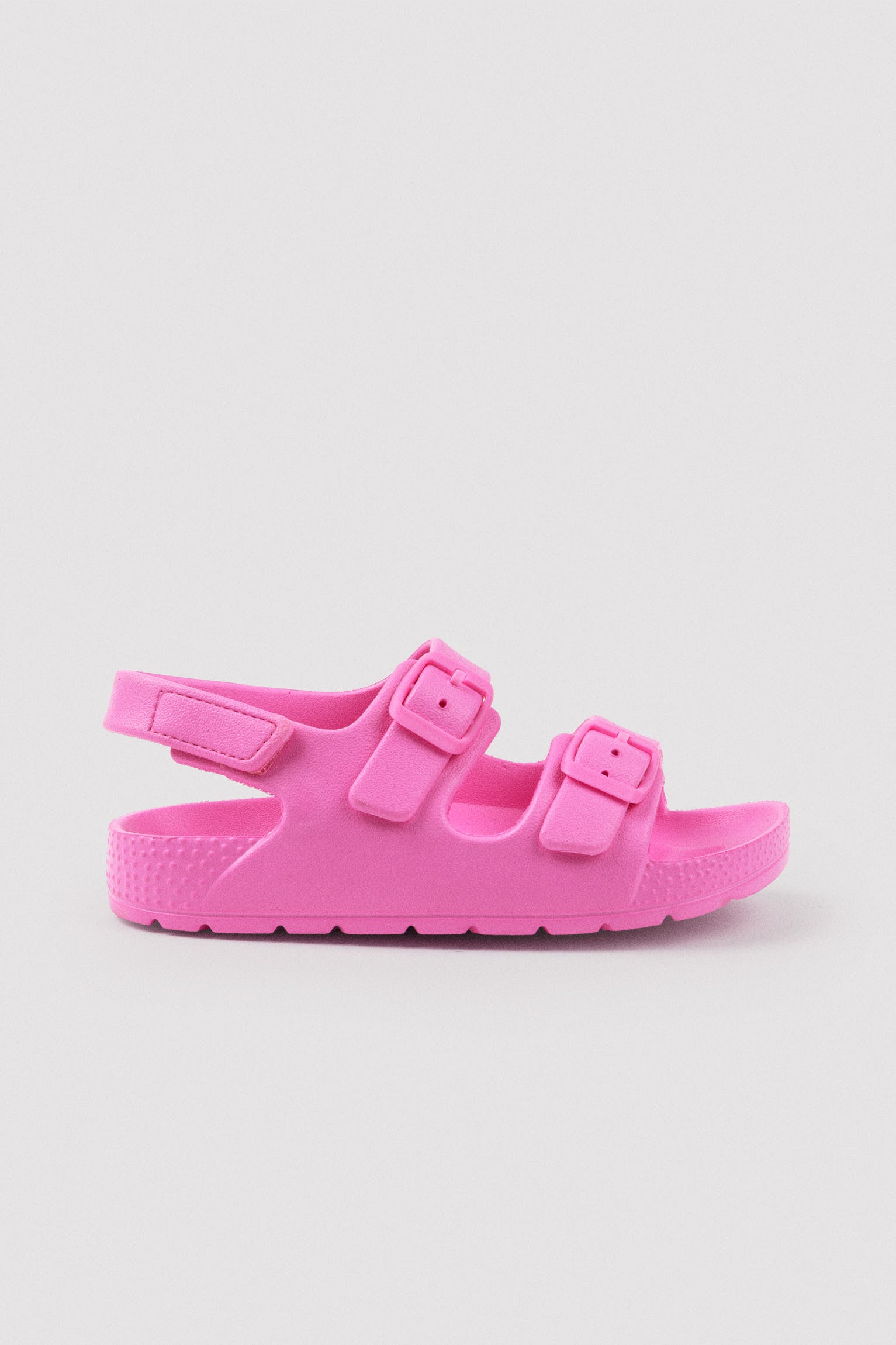 Pink children's flip-flops with adjustable buckles and velcro