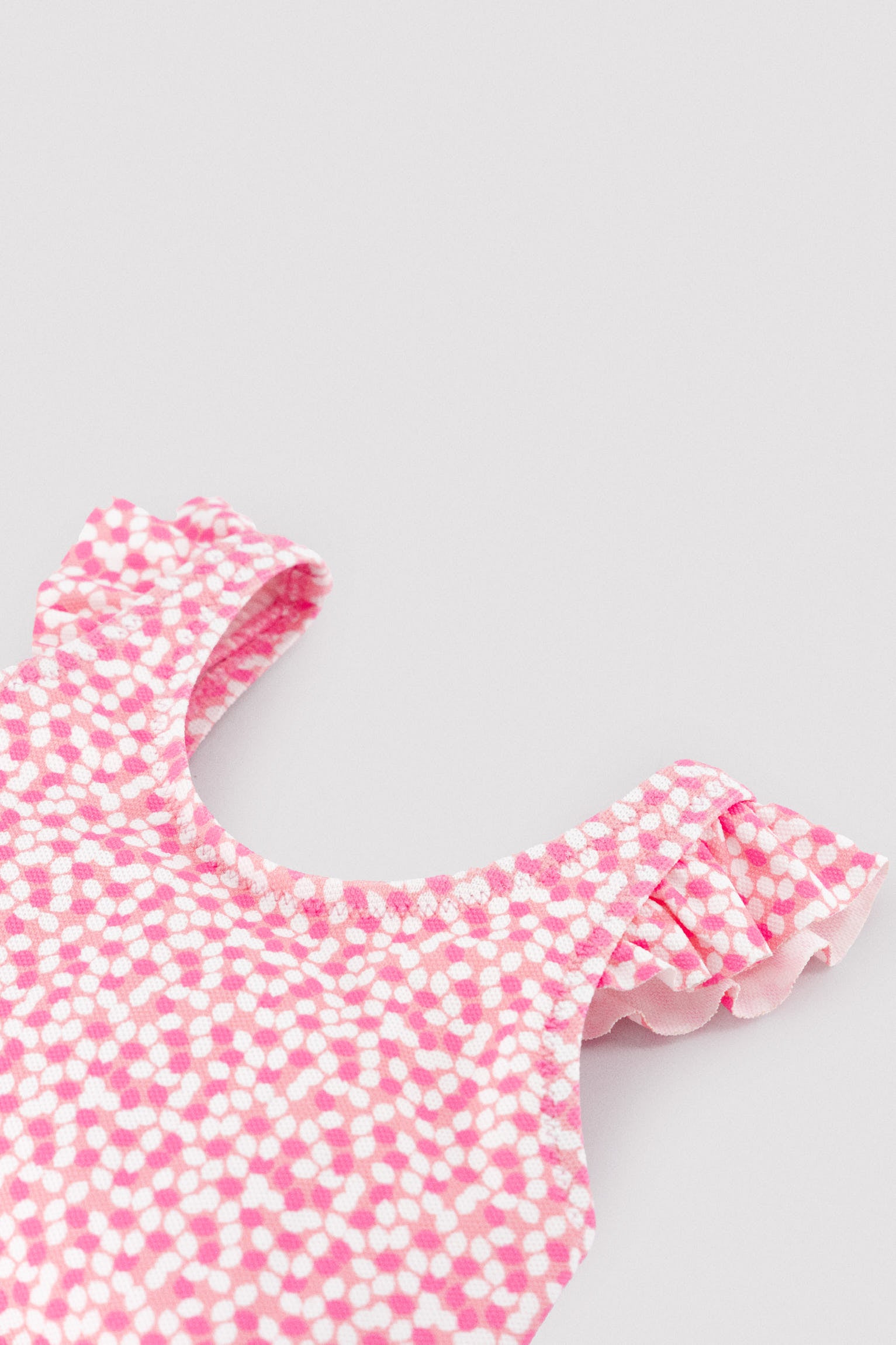Baby girl swimsuit with ruffle details and floral print