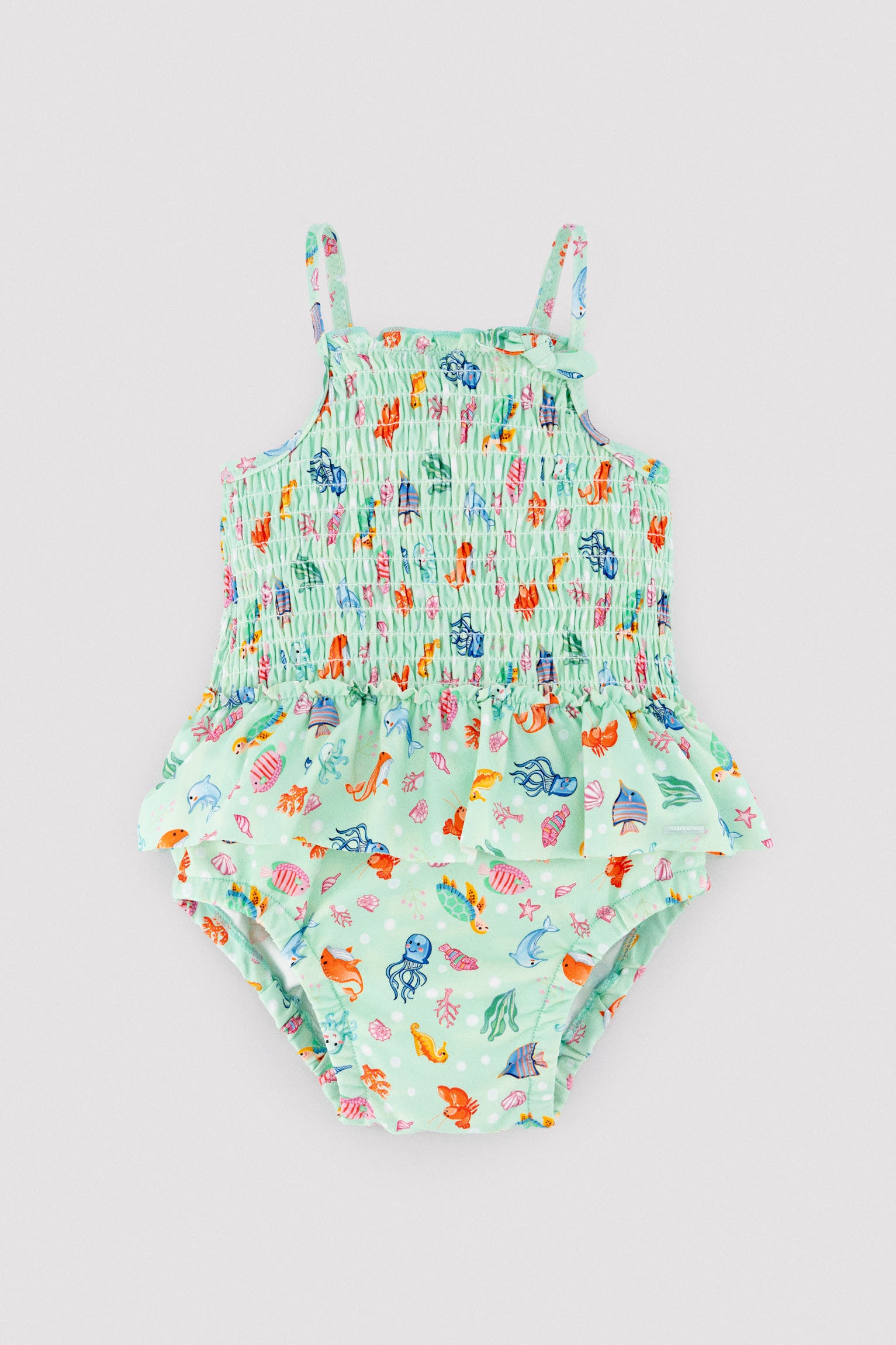 Baby girl swimsuit with ruffle detail and honeycomb print with marine fauna pattern