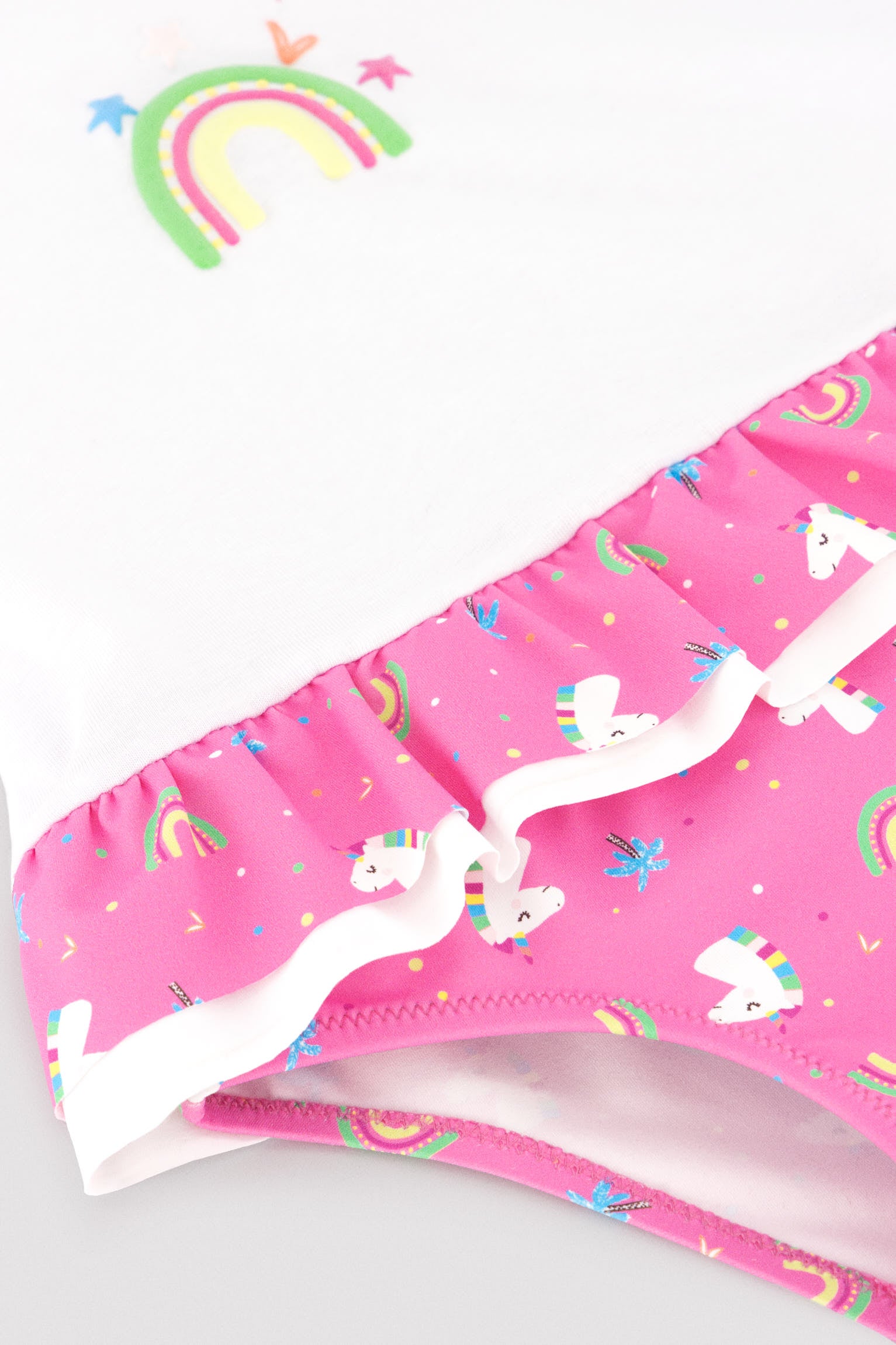 Baby set: t-shirt and bloomers with ruffle and bow details, unicorn print