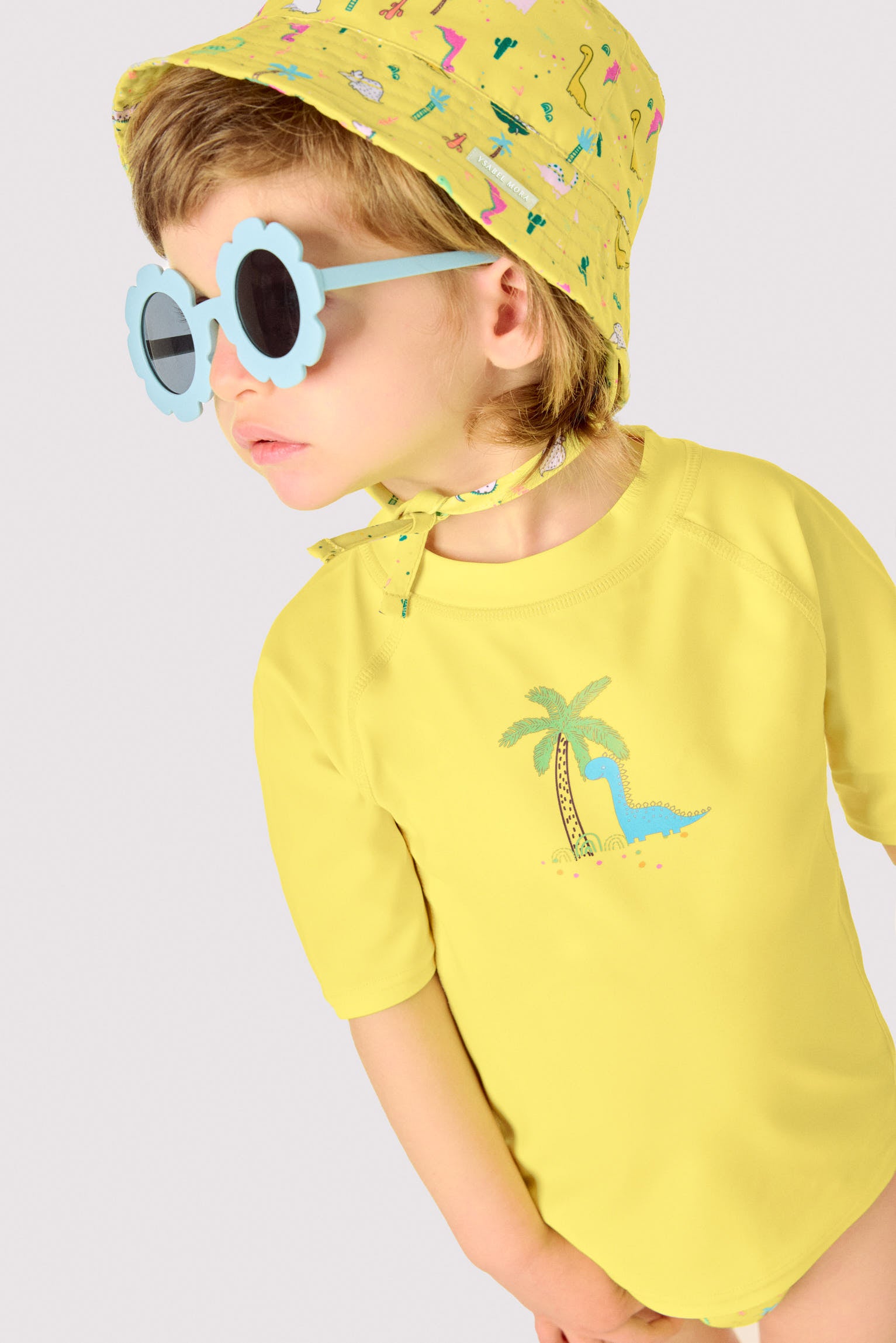 Baby swim shirt with dinosaur and palm tree print