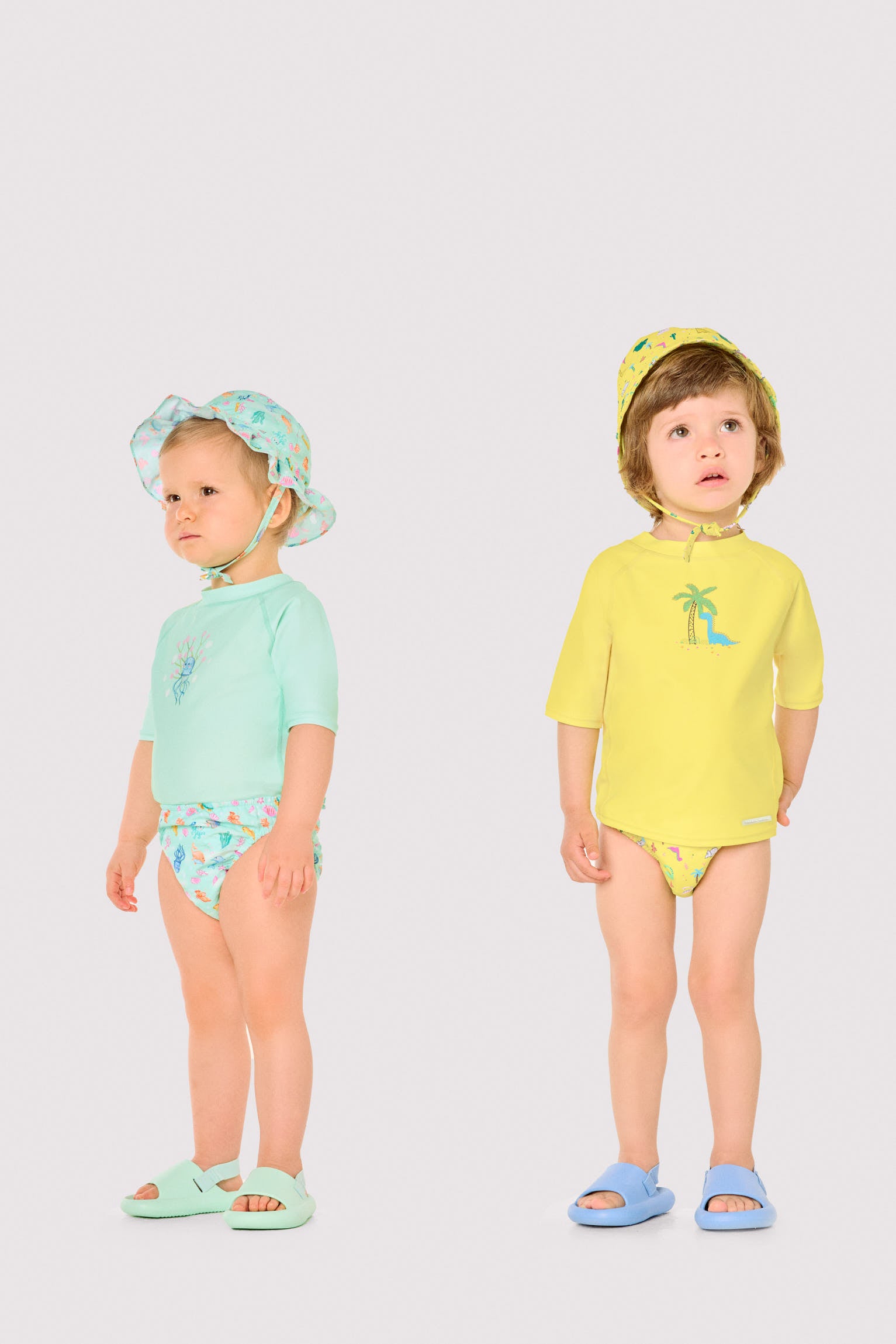 Baby swim shirt with dinosaur and palm tree print