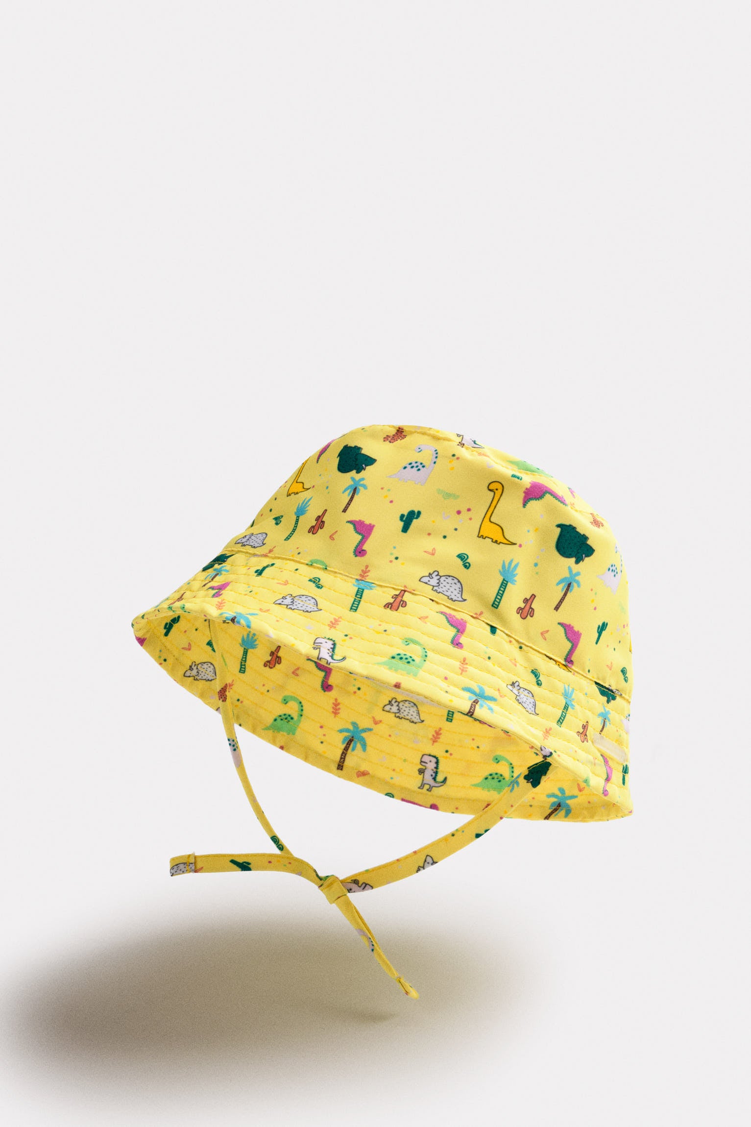 Baby beach hat with straight brim and dinosaur print
