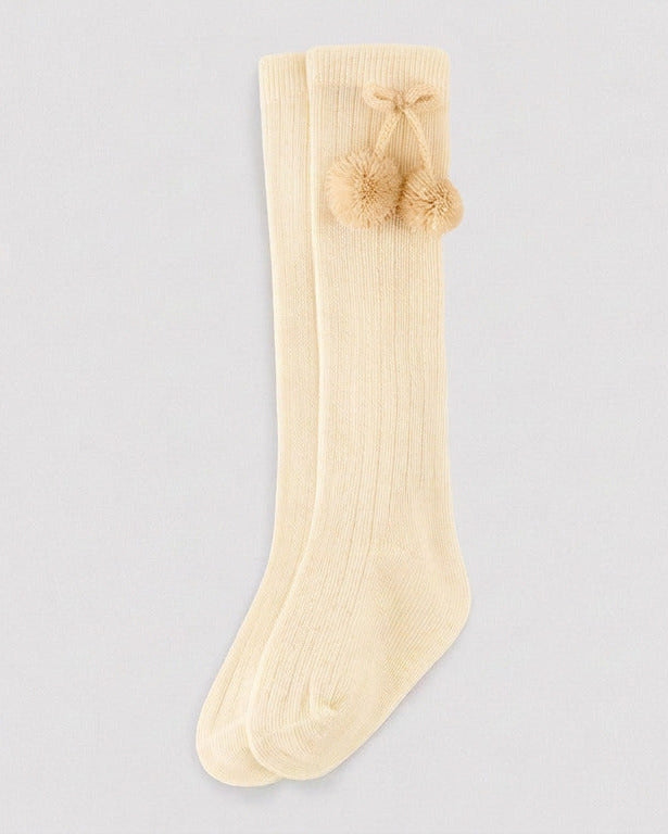 Children's long beige socks with pompom details
