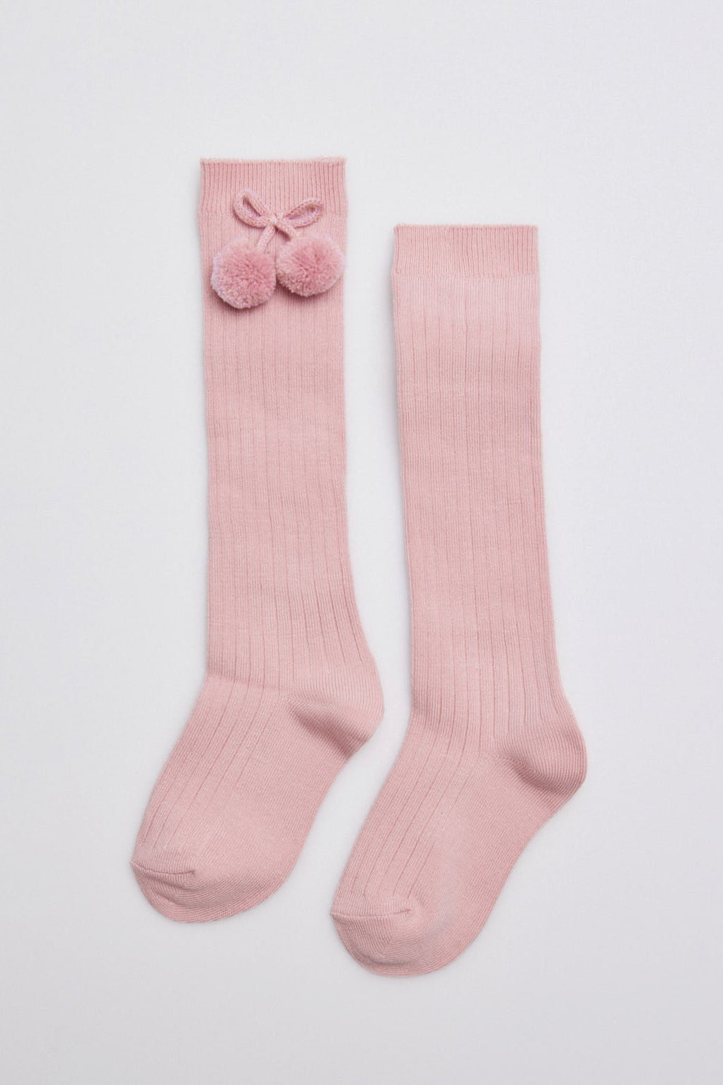 Children's long pink socks with pompom details