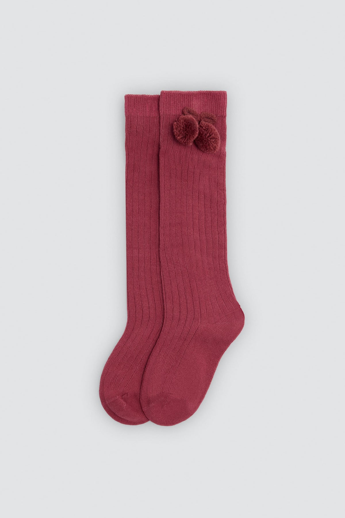 Children's long pink socks with pompom details