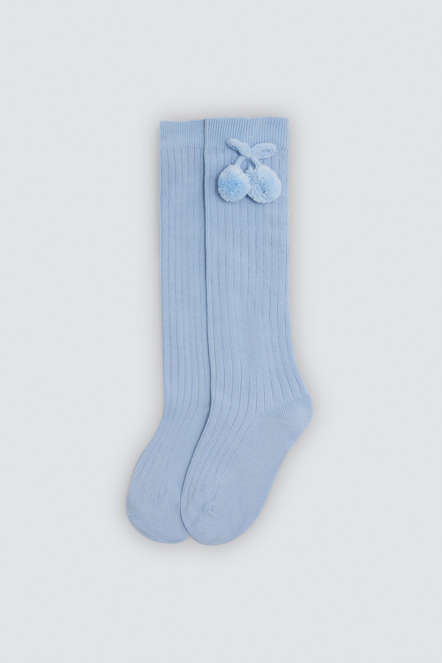 Children's long blue socks with pompom details