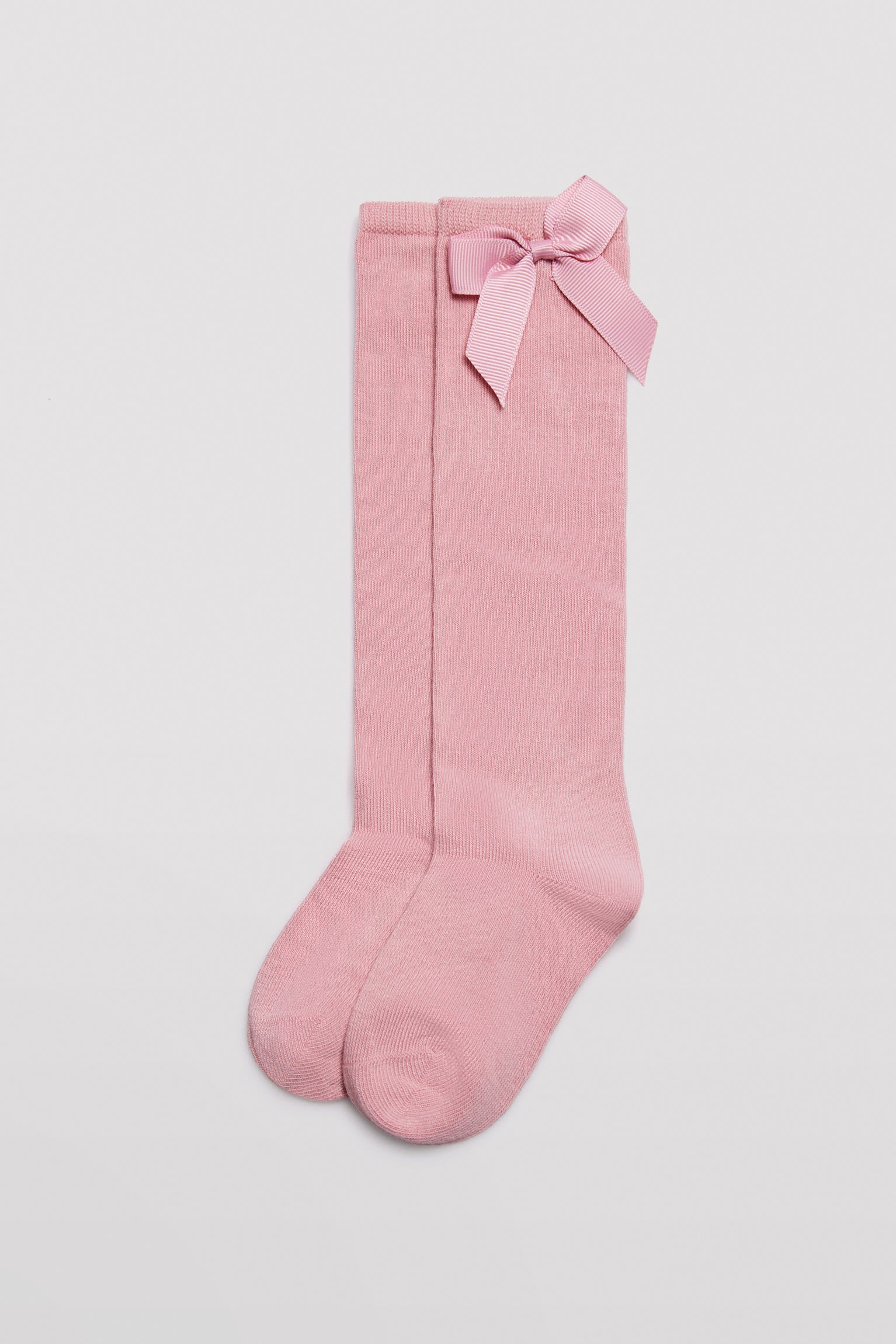 Long children's sock with pink bow detail