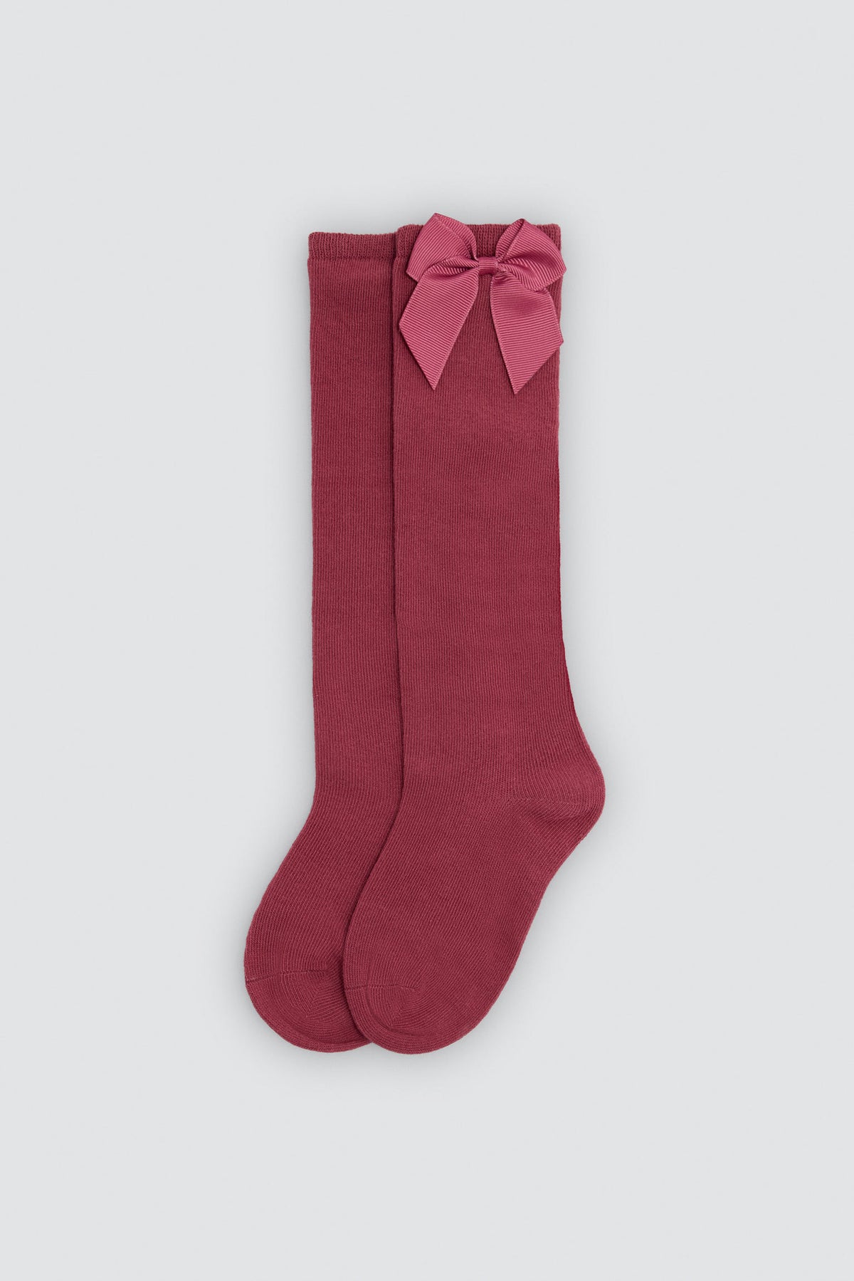 Long children's sock with pink bow detail
