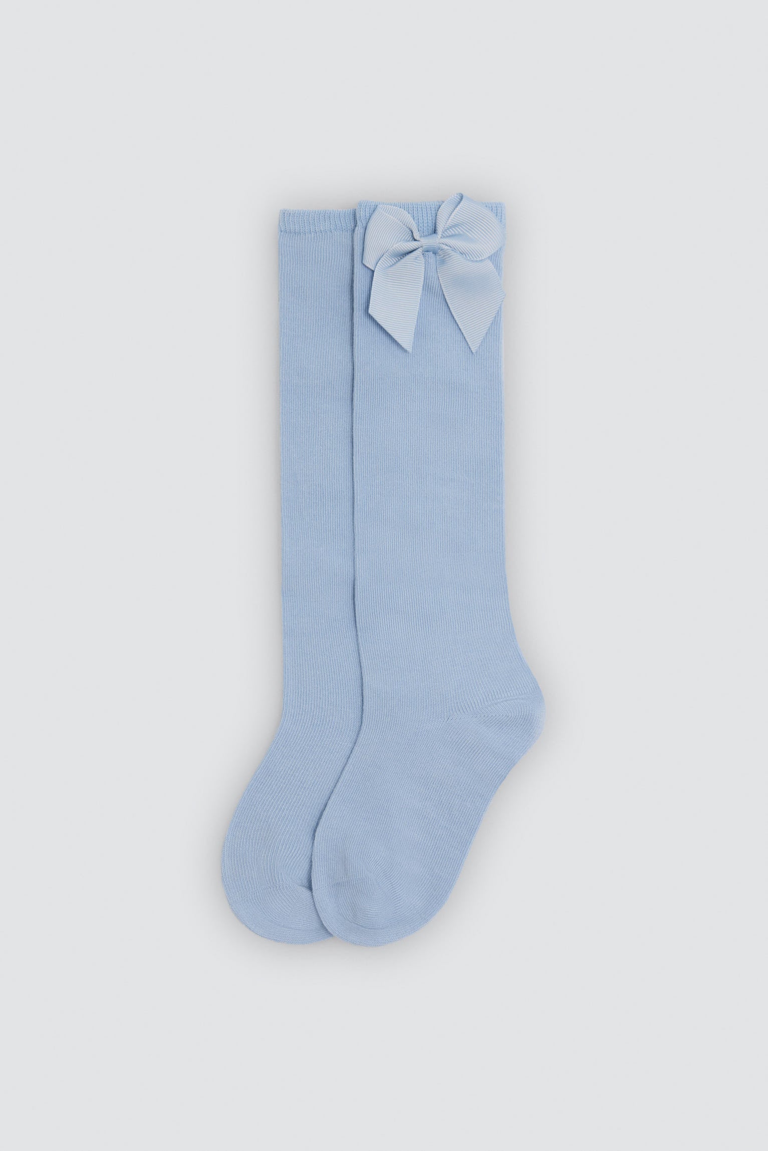 Children's long blue socks with bow detail