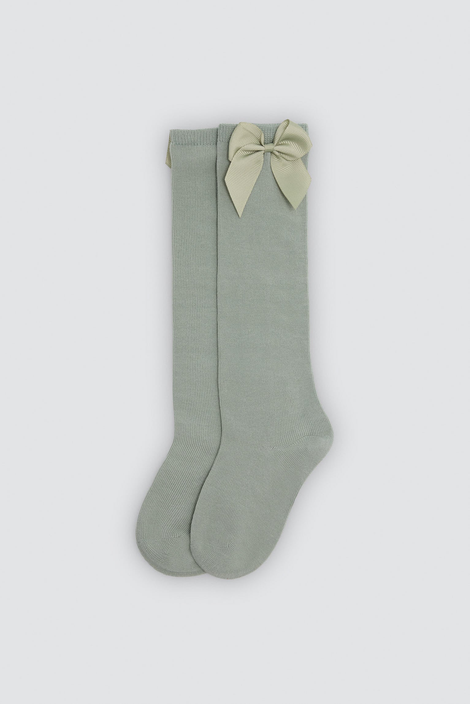 Children's long green socks with bow detail