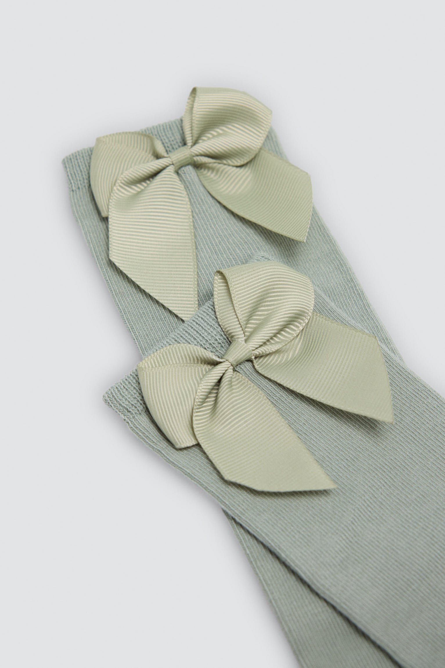 Children's long green socks with bow detail