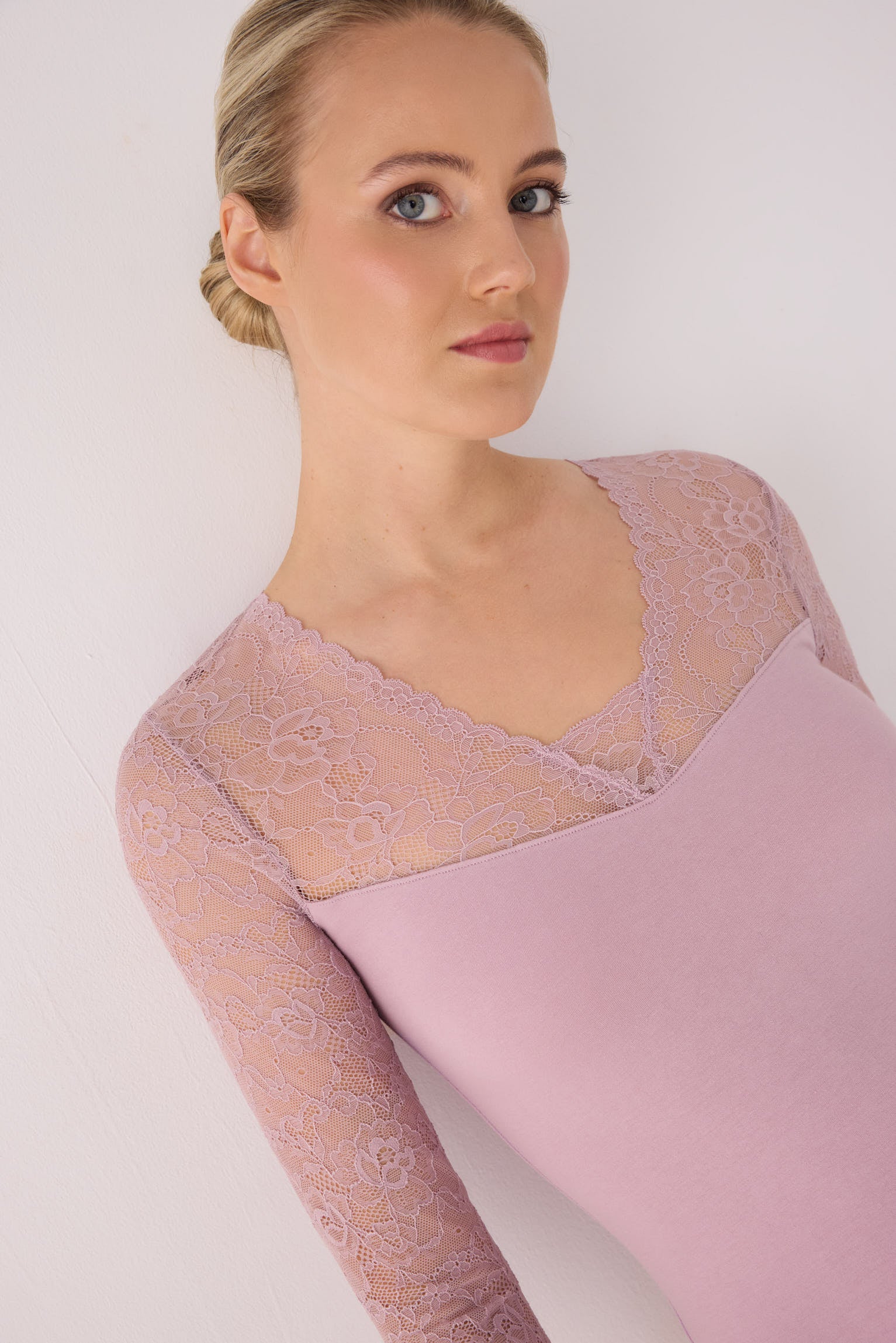 Pink long-sleeve top with lace neckline and sleeves