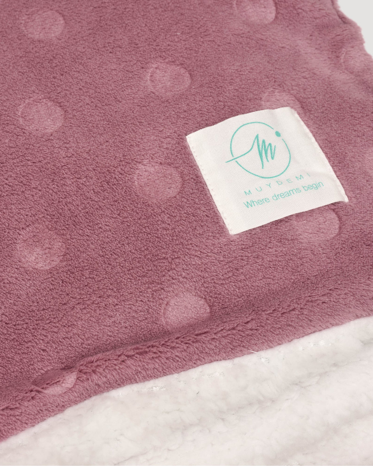 Polka-dot coral fleece and shearling blanket