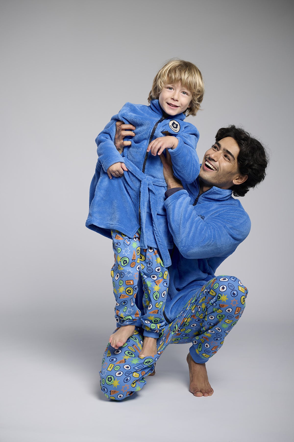 Men's short blue coral fleece robe with embroidered detail