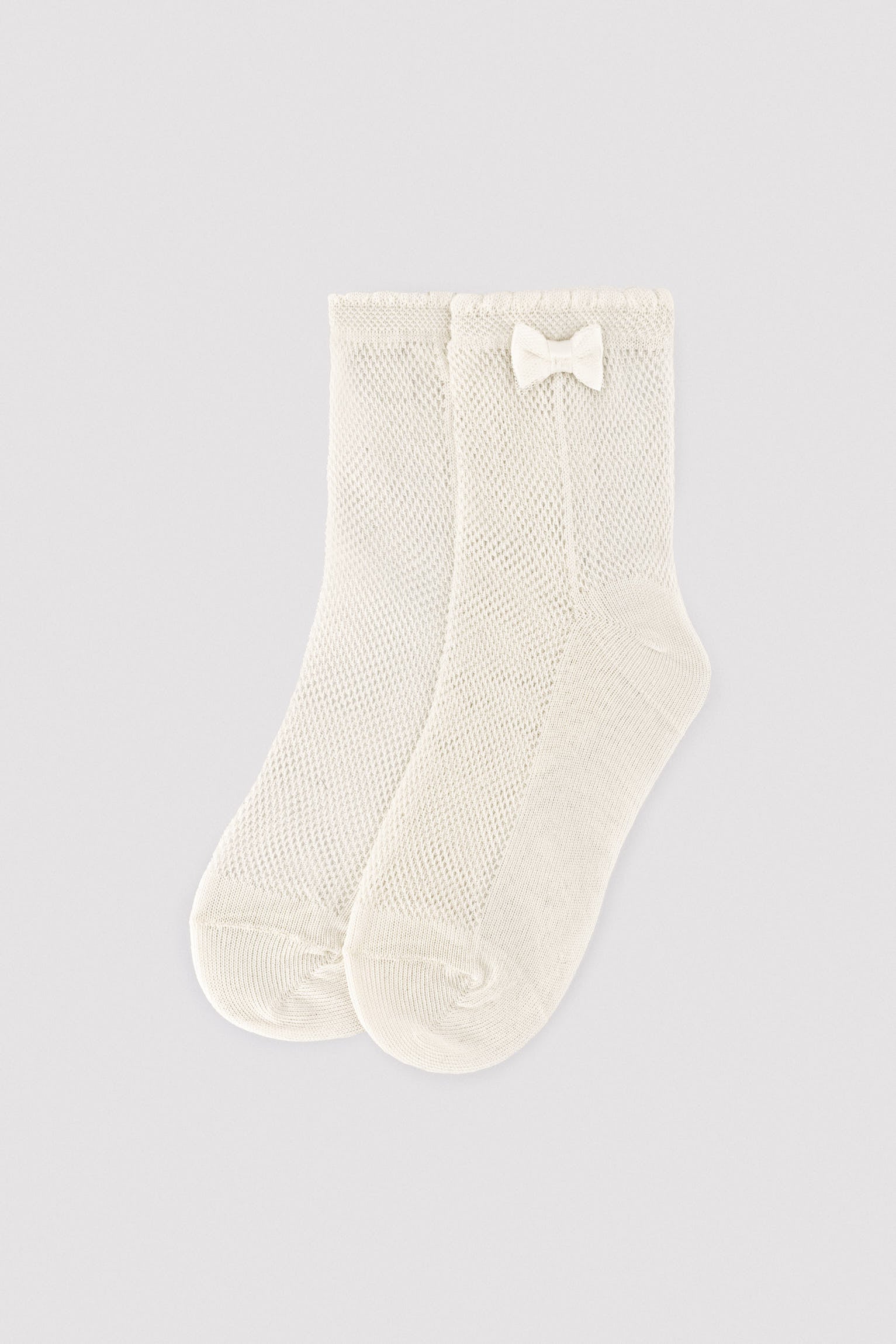 Children's openwork socks with ivory bow detail