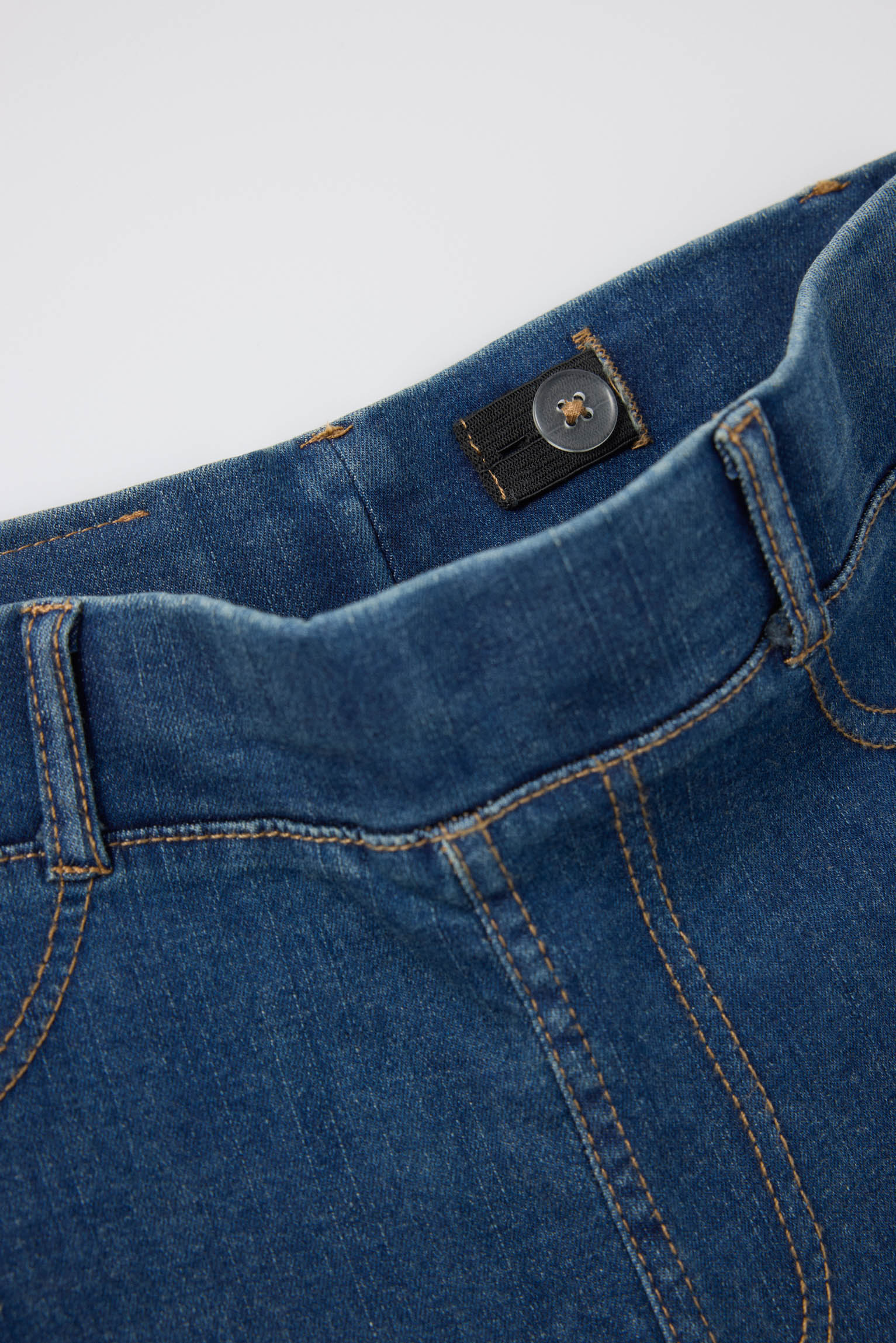 Girls' flared denim-effect trousers