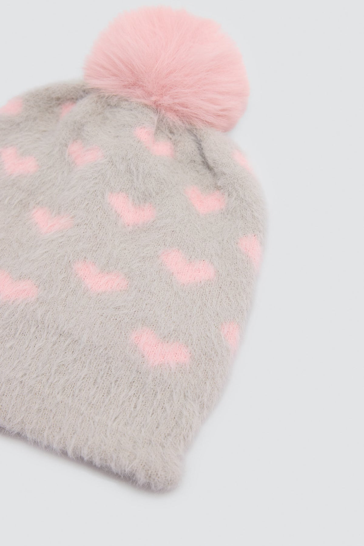 Gorro para niña detalle pompón interior forro polar estampado corazones
